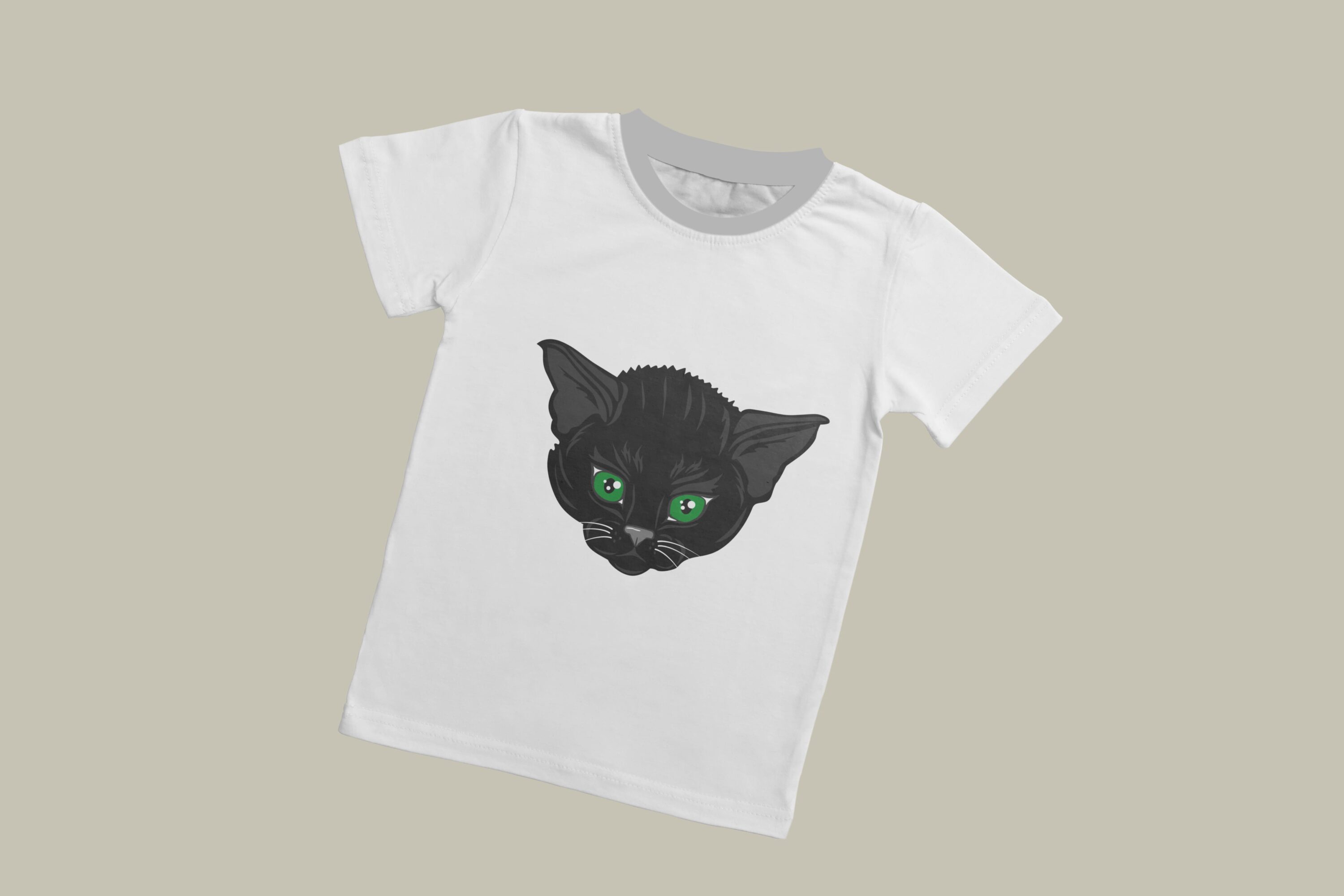 A white T-shirt with a grey collar and the face of a little black cat with green eyes on a grey background.