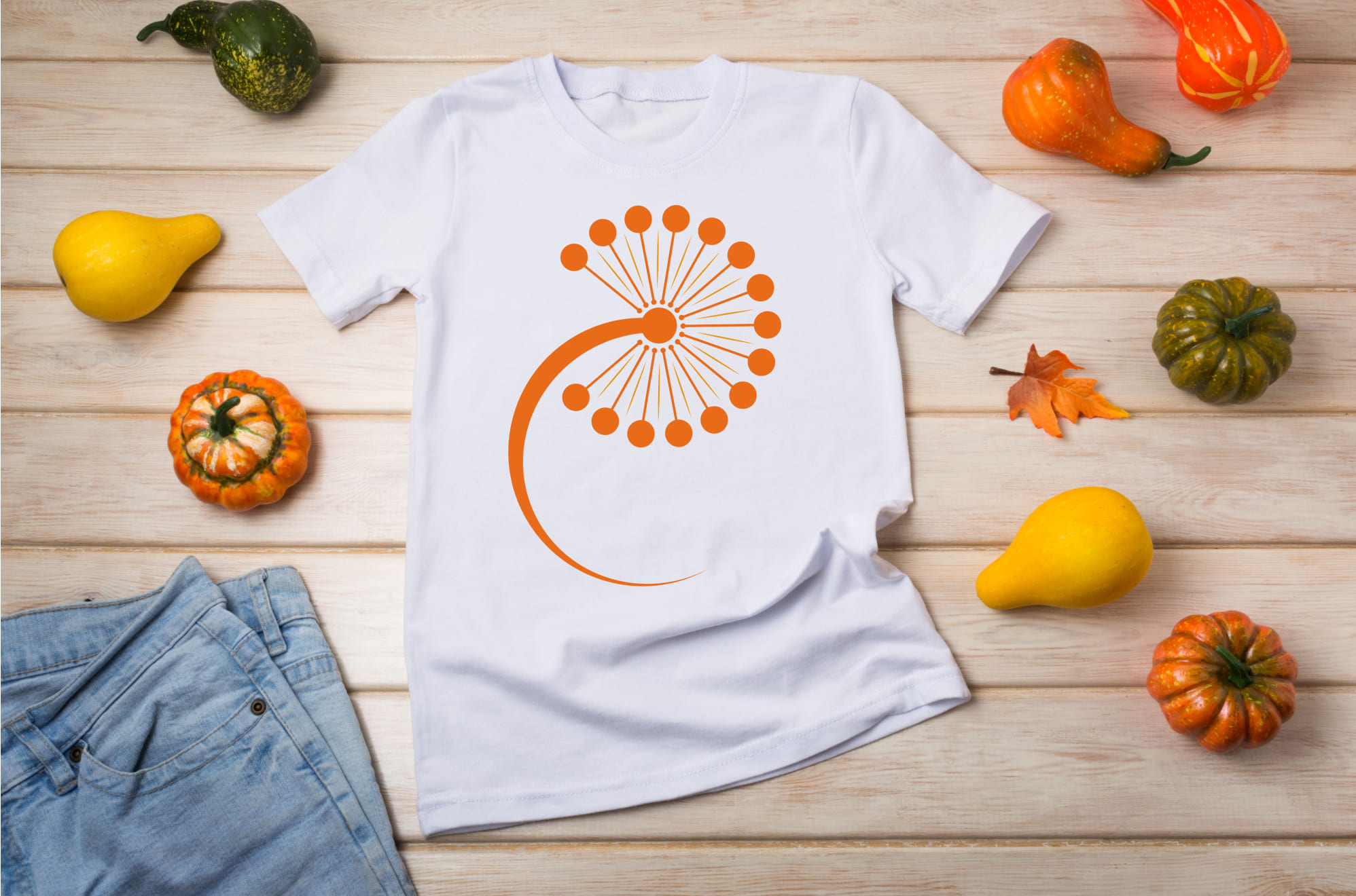 White T-shirt with a orange dandelion flower and pumpkins.