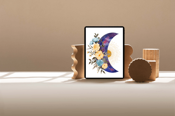 A picture with illustration of a blue moon with watercolor floral frame on a sun background in black frame.