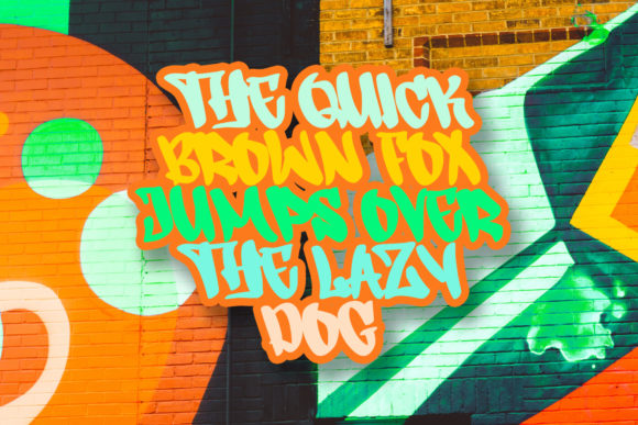 Colorful "The quick brown fox jumps over the lazy dog" lettering in graffiti font on a graffiti background.