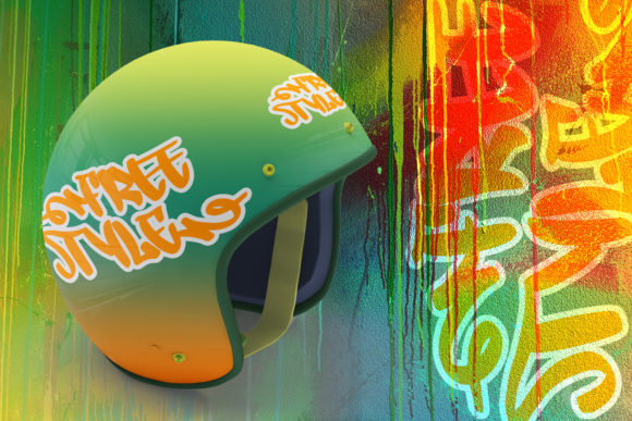 A green helmet with a orange "Free Style" lettering in graffiti font on a graffiti background.