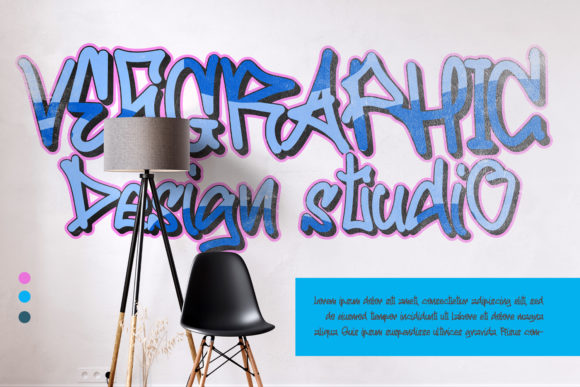 Blue "Vesgraphic Design Studio" lettering in graffiti font against a cool image.