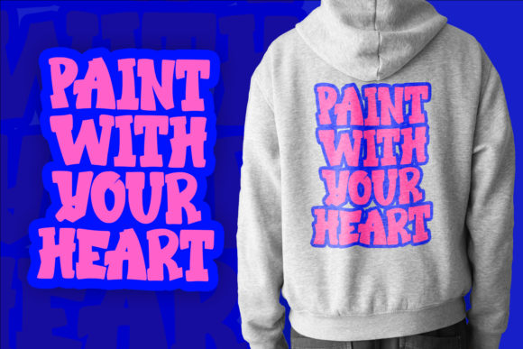 A gray sweatshirt with a pink "Paint with your heart" lettering and the same lettering in graffiti font on a blue background.