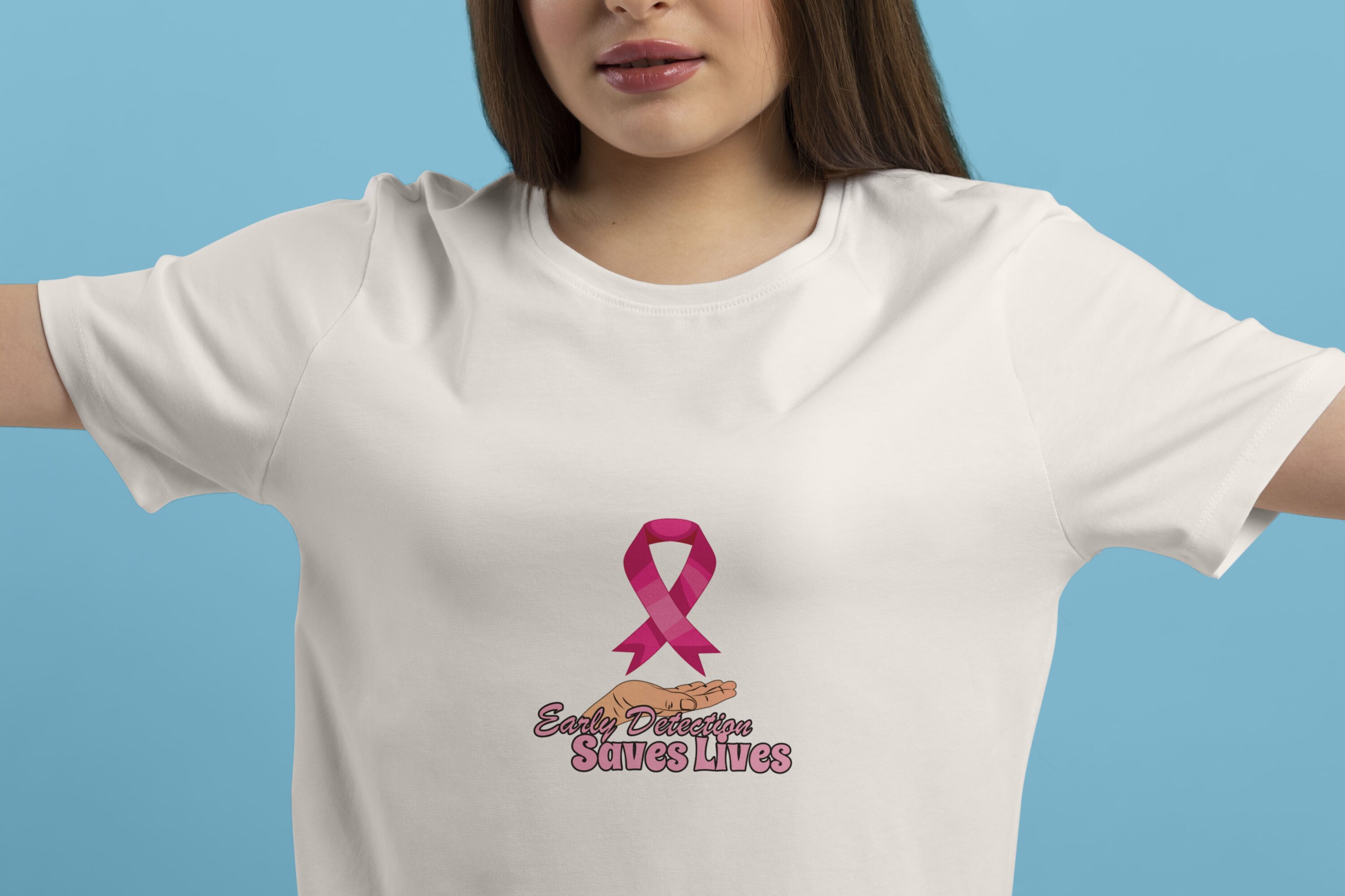 Classic pink breast cancer ribbon on a white t-shirt.