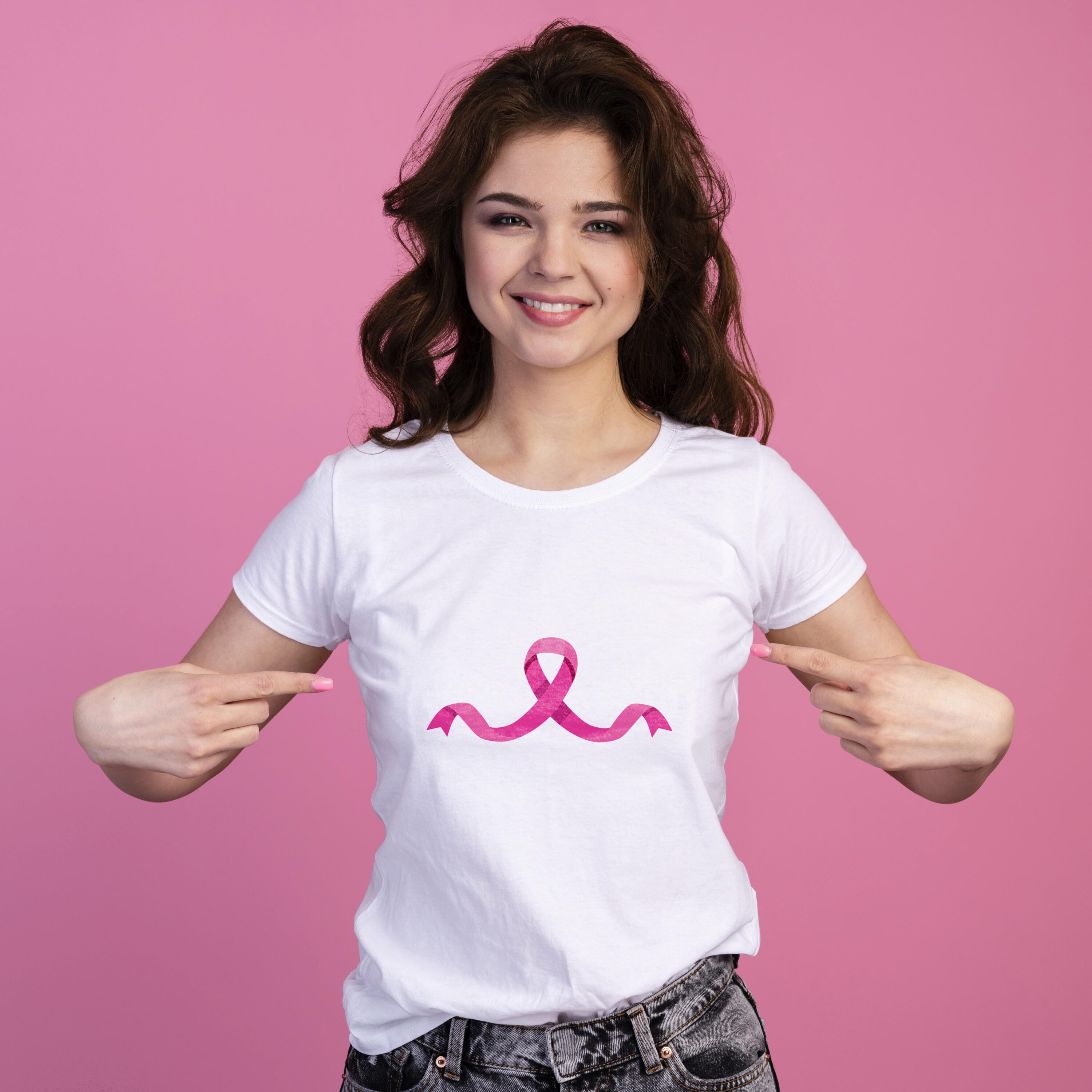 Small curvy breast cancer ribbon on a white t-shirt.
