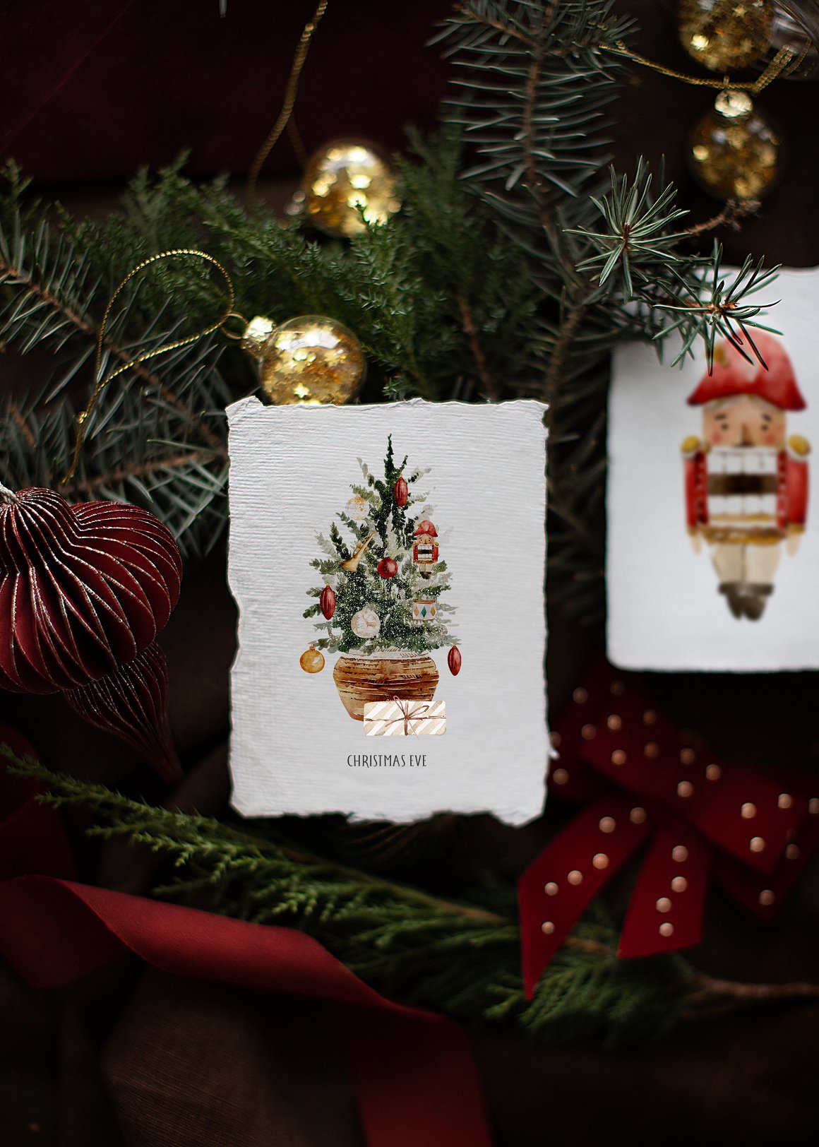 A white greeting card with black lettering "Christmas Eve" and an illustration of a christmas tree.