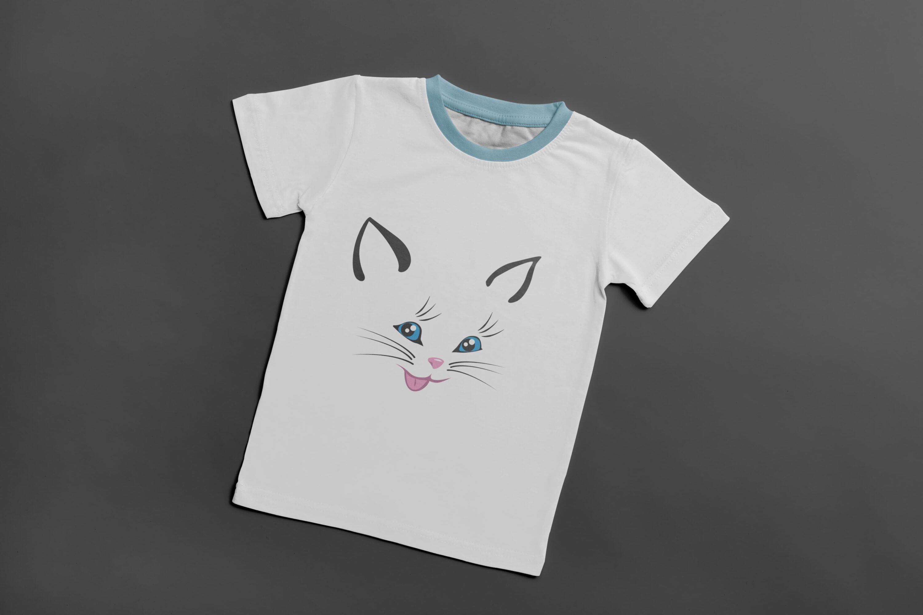 A white t-shirt with a light blue collar and the face of a smiling cat with blue eyes.