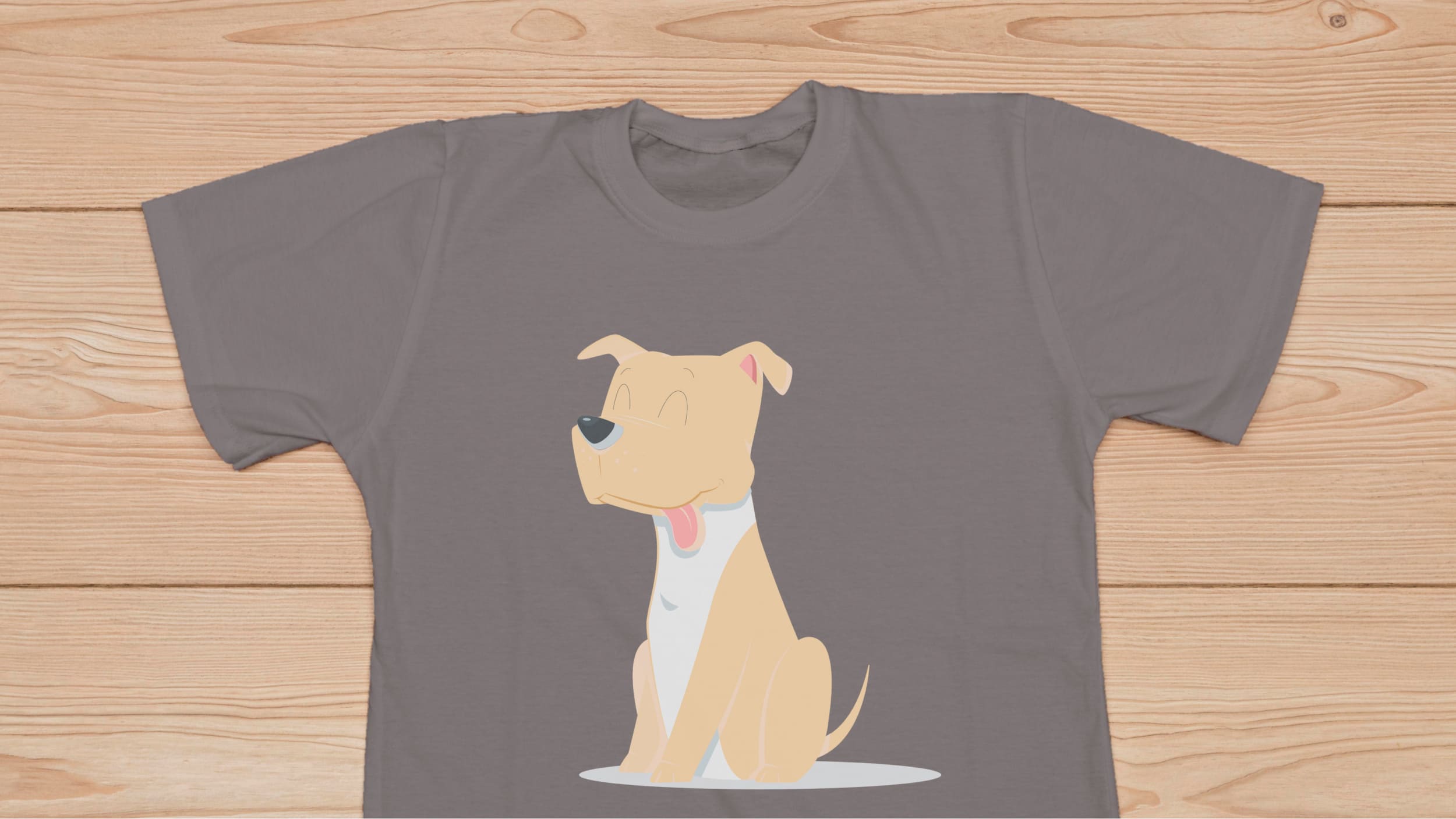 Gray t-shirt with a cute ginger pitbull on the wooden background.