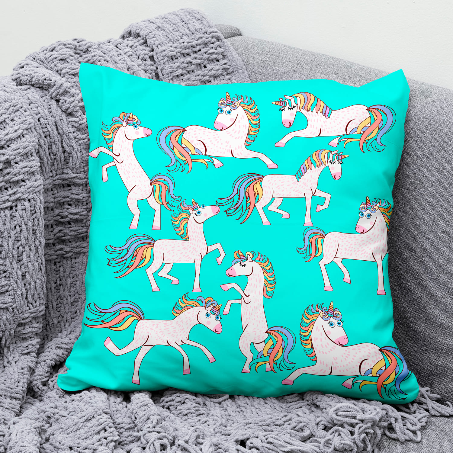 Bright blue pillow with cute unicorn design.