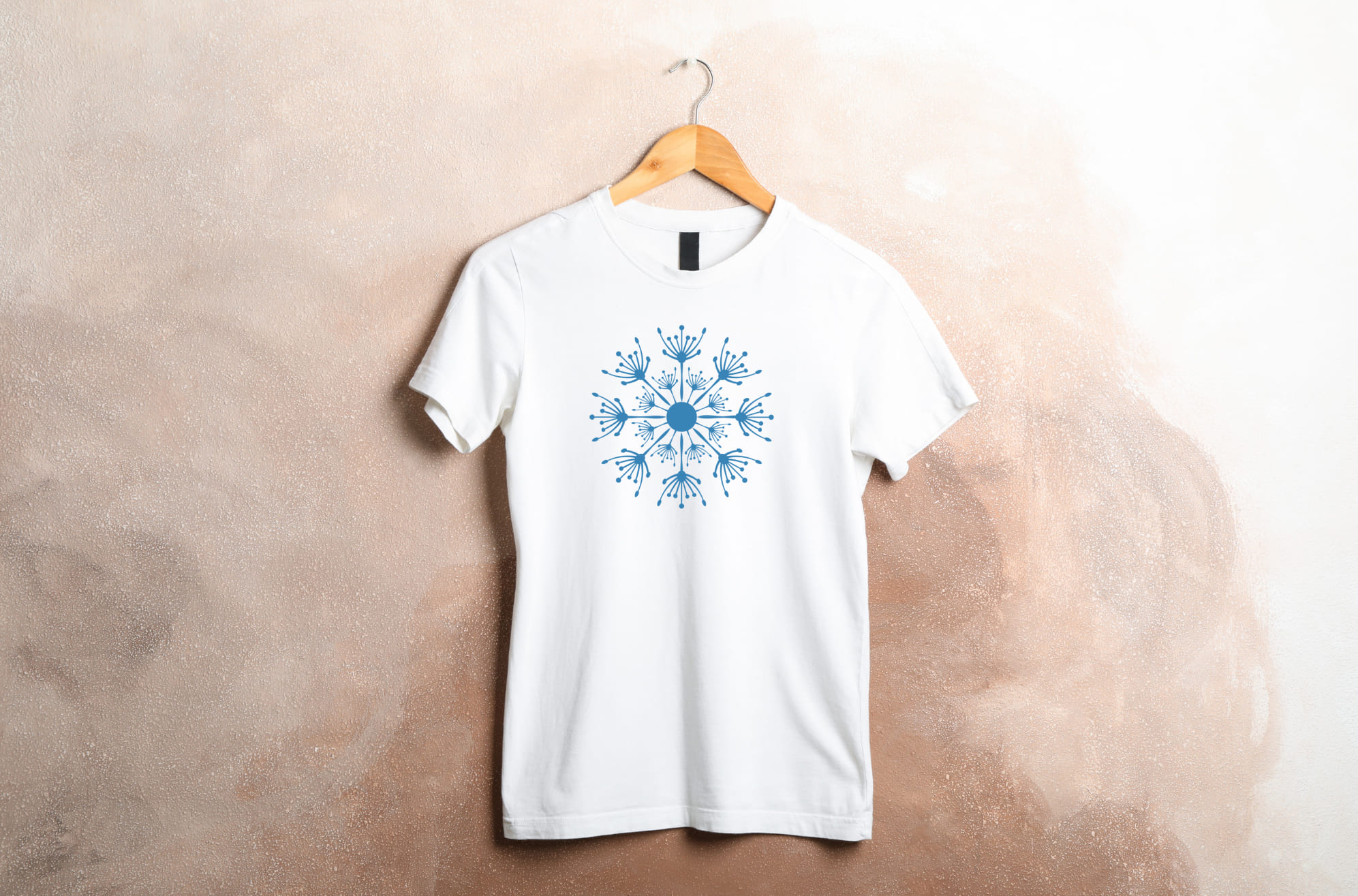 T-shirt image with colorful dandelion print in blue.