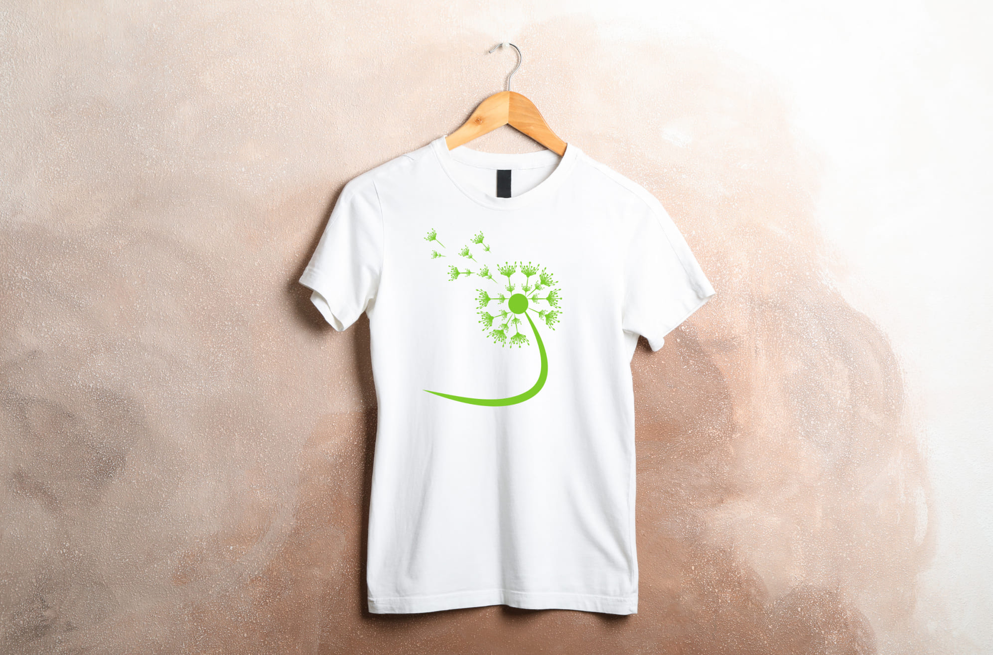 T-shirt image with adorable dandelion print in green.