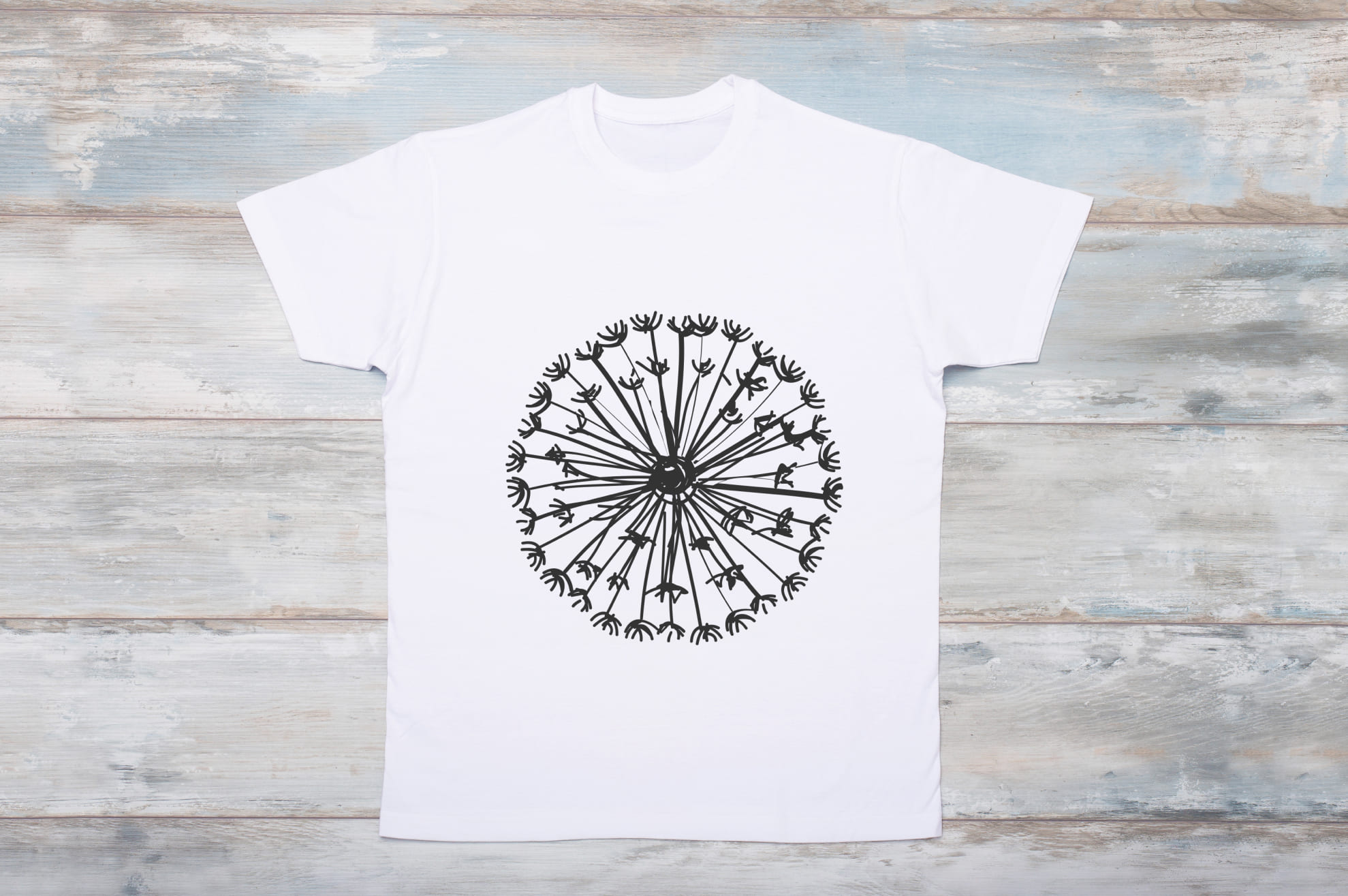 Image of white t-shirt with unique dandelion print.
