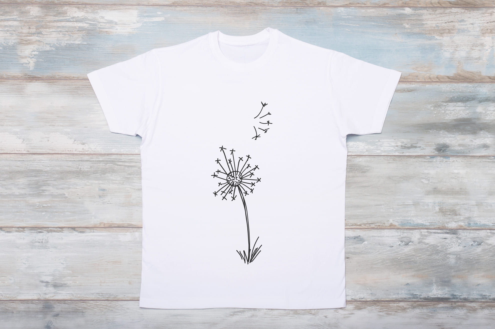 Picture of white t-shirt with amazing dandelion print.