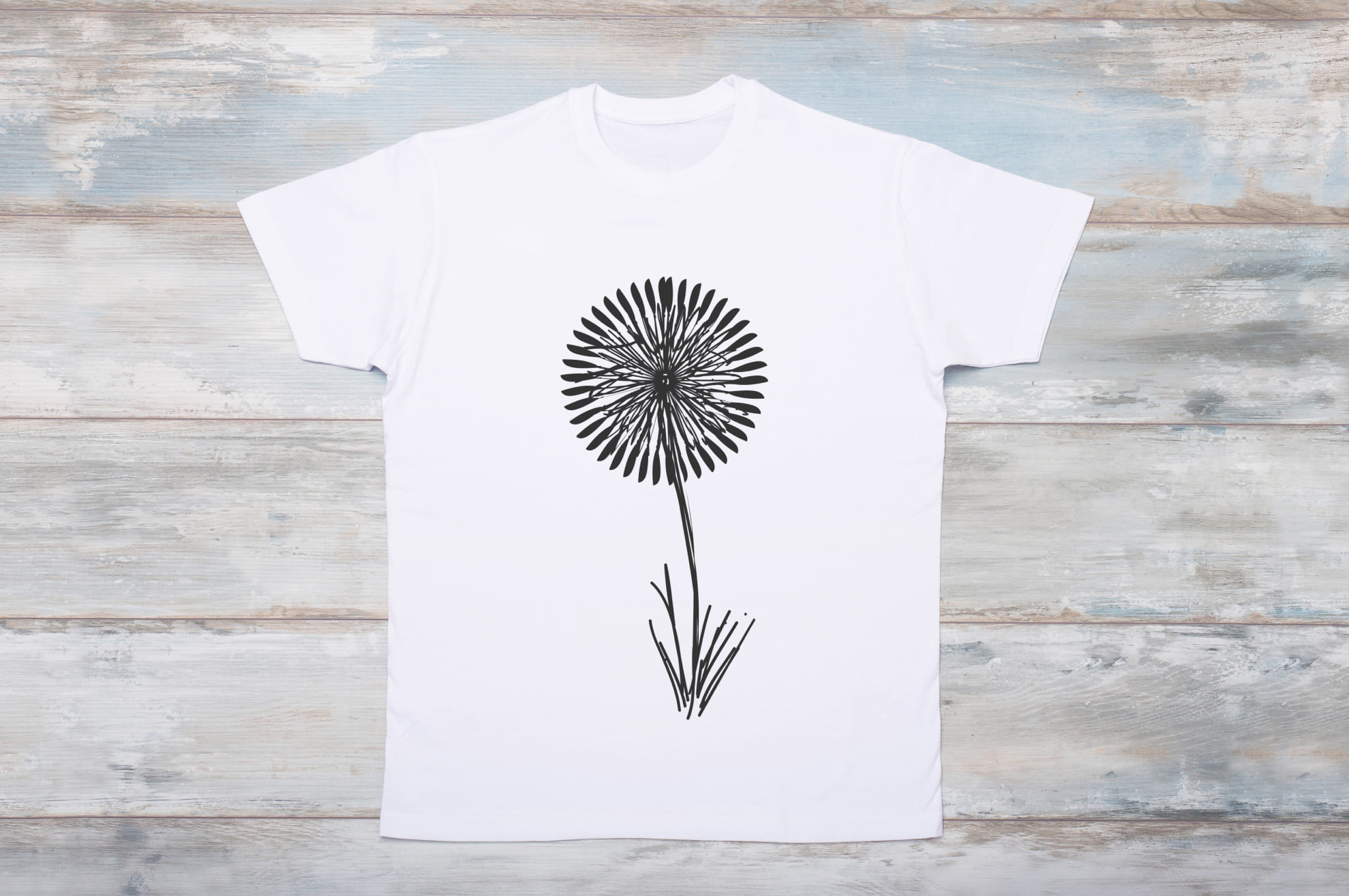Picture of a white t-shirt with a wonderful dandelion print.