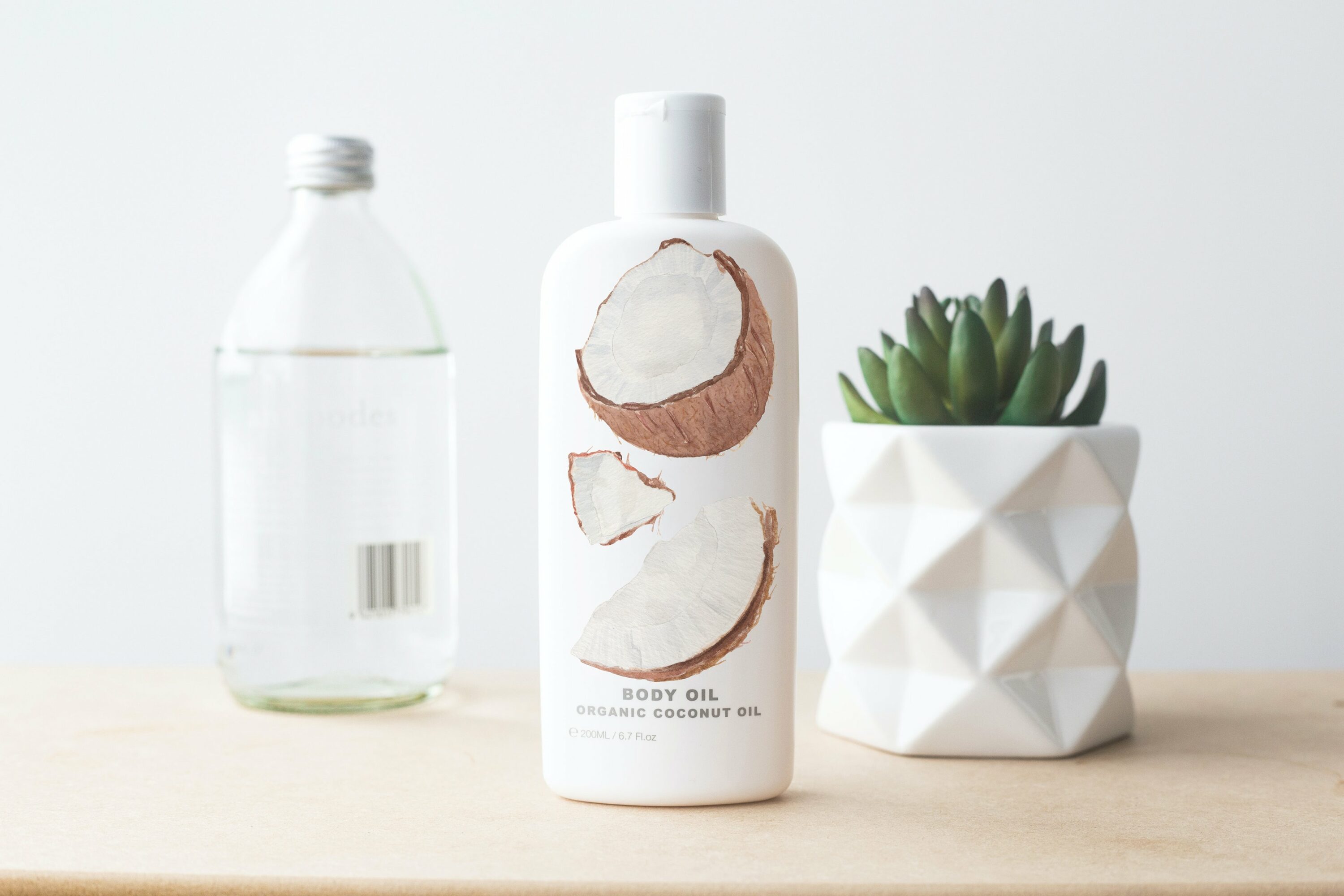 White bottle with the coconut for the beauty industry.