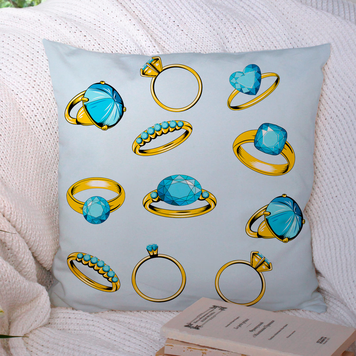 Blue pillow with a diamond ring.