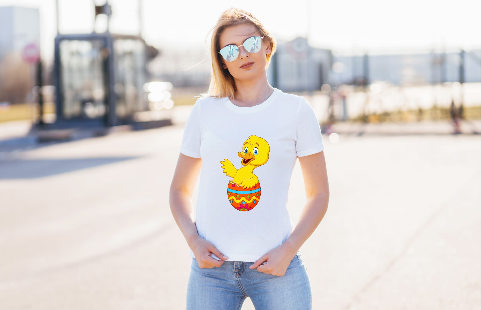 Image of white t-shirt with cute print of easter egg and duckling.