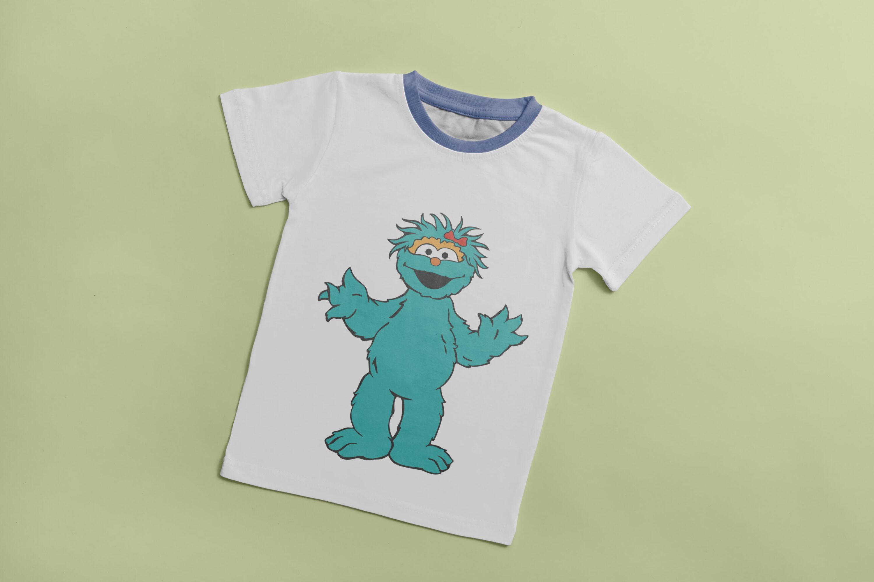 White T-shirt with a blue collar and an image of a turquoise smiling Cookie Monster.