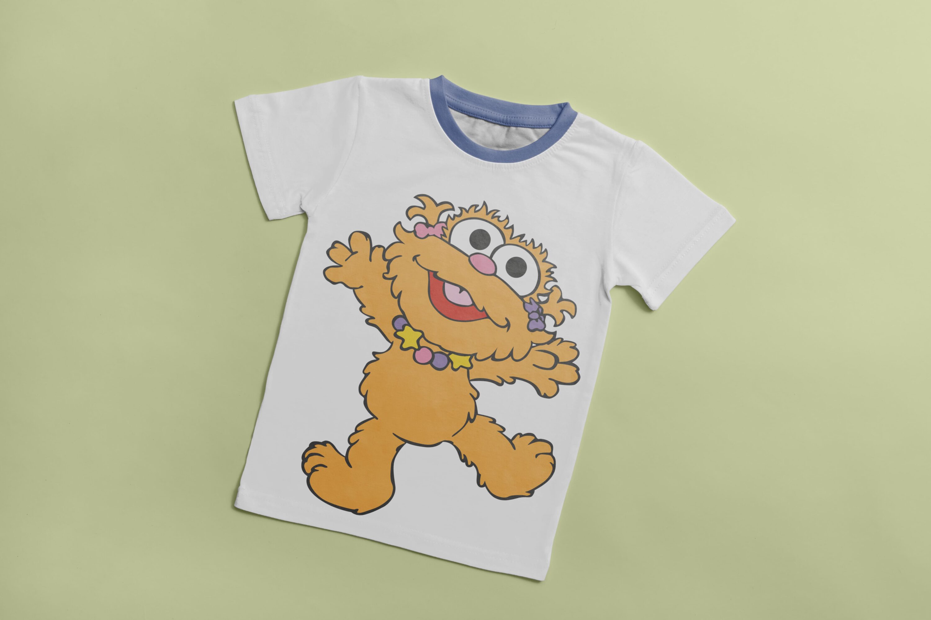 White T-shirt with a blue collar and an image of an yellow funny baby Cookie Monster.