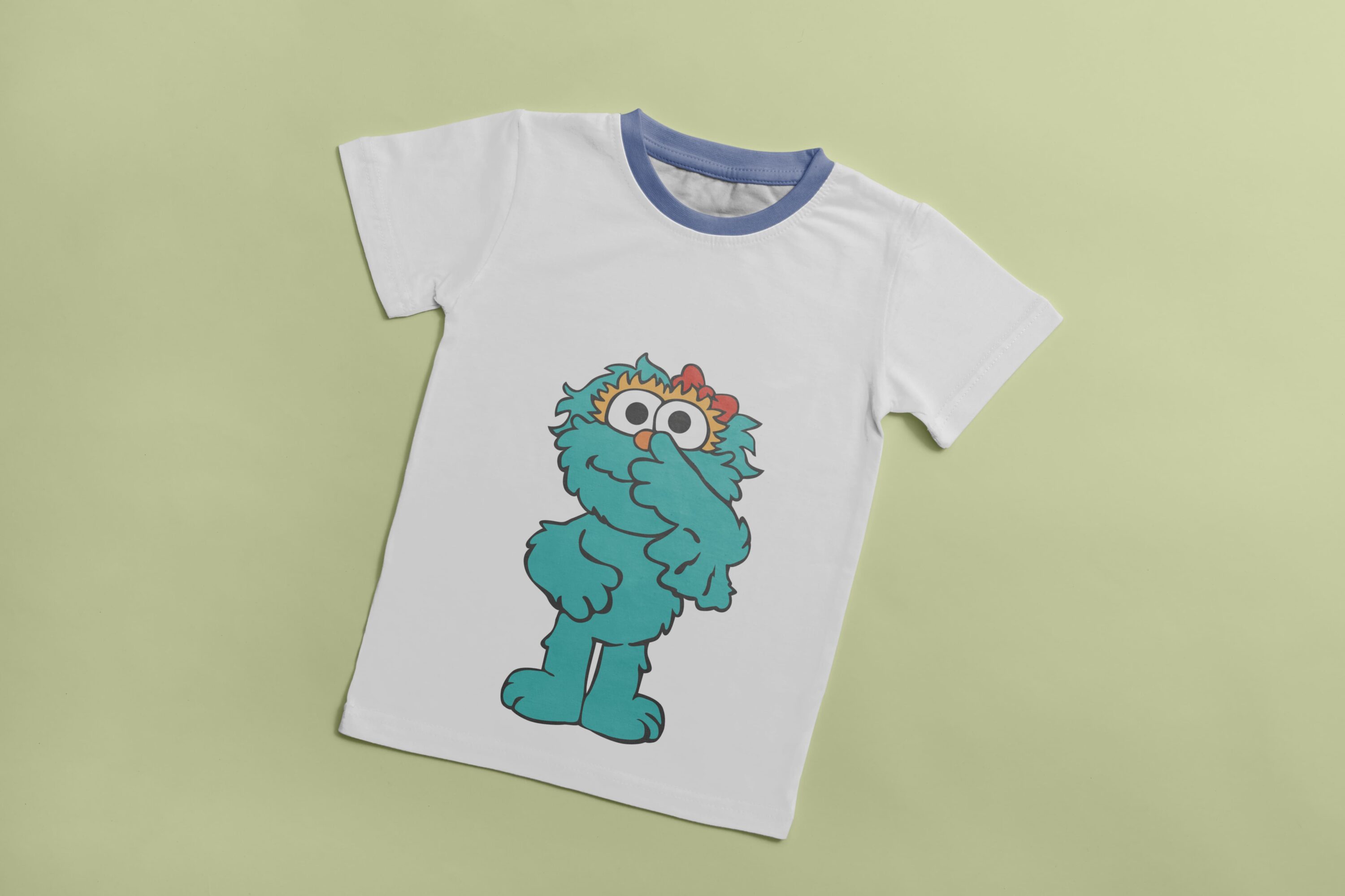White T-shirt with a blue collar and an image of a turquoise surprised Cookie Monster.