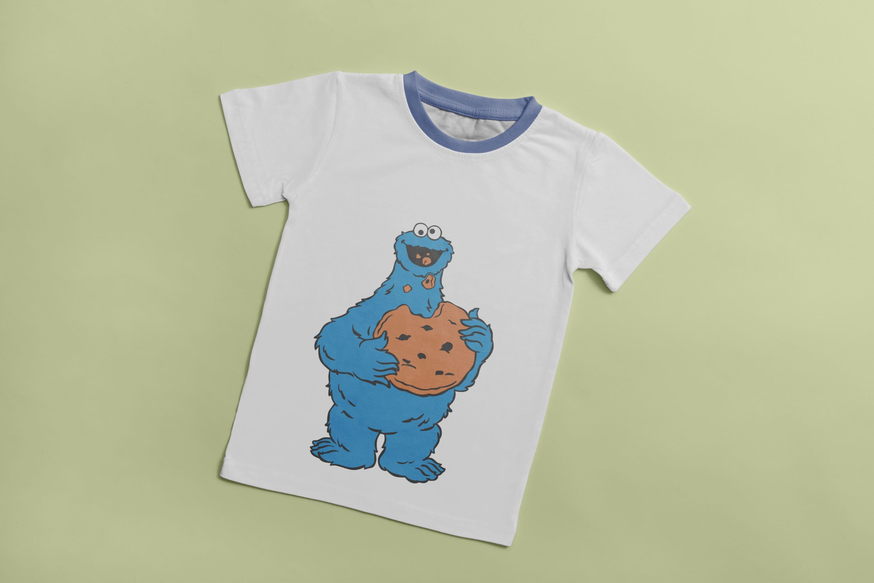 White T-shirt with a blue collar and an image of a blue Cookie Monster, who eats cookie.