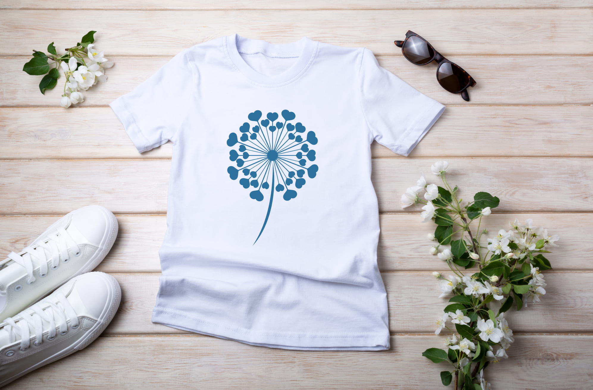 White T-shirt with blue dandelion flower and sunglasses with white sneakers.