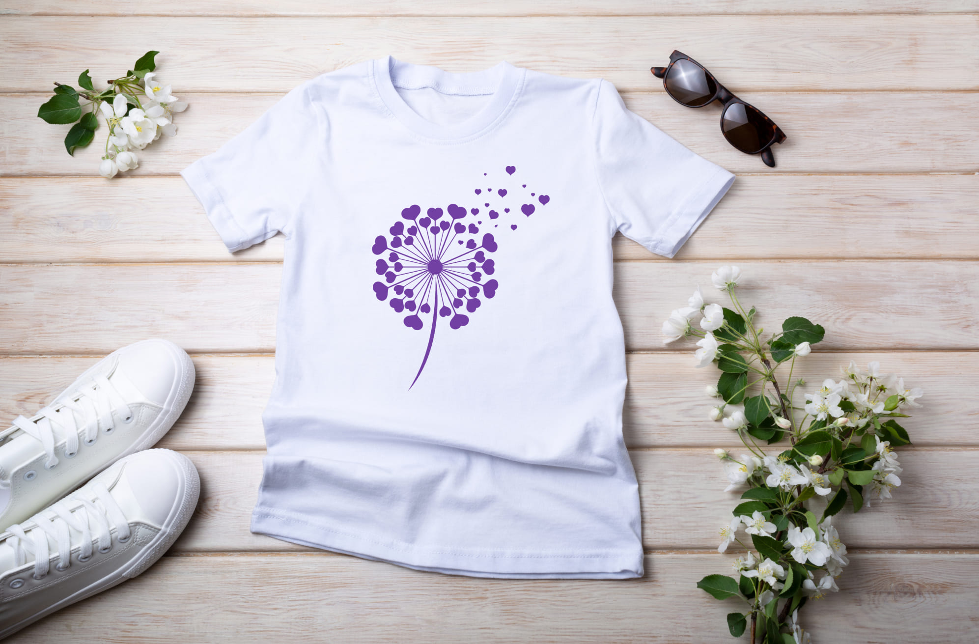 White T-shirt with purple dandelion flower and sunglasses with white sneakers.