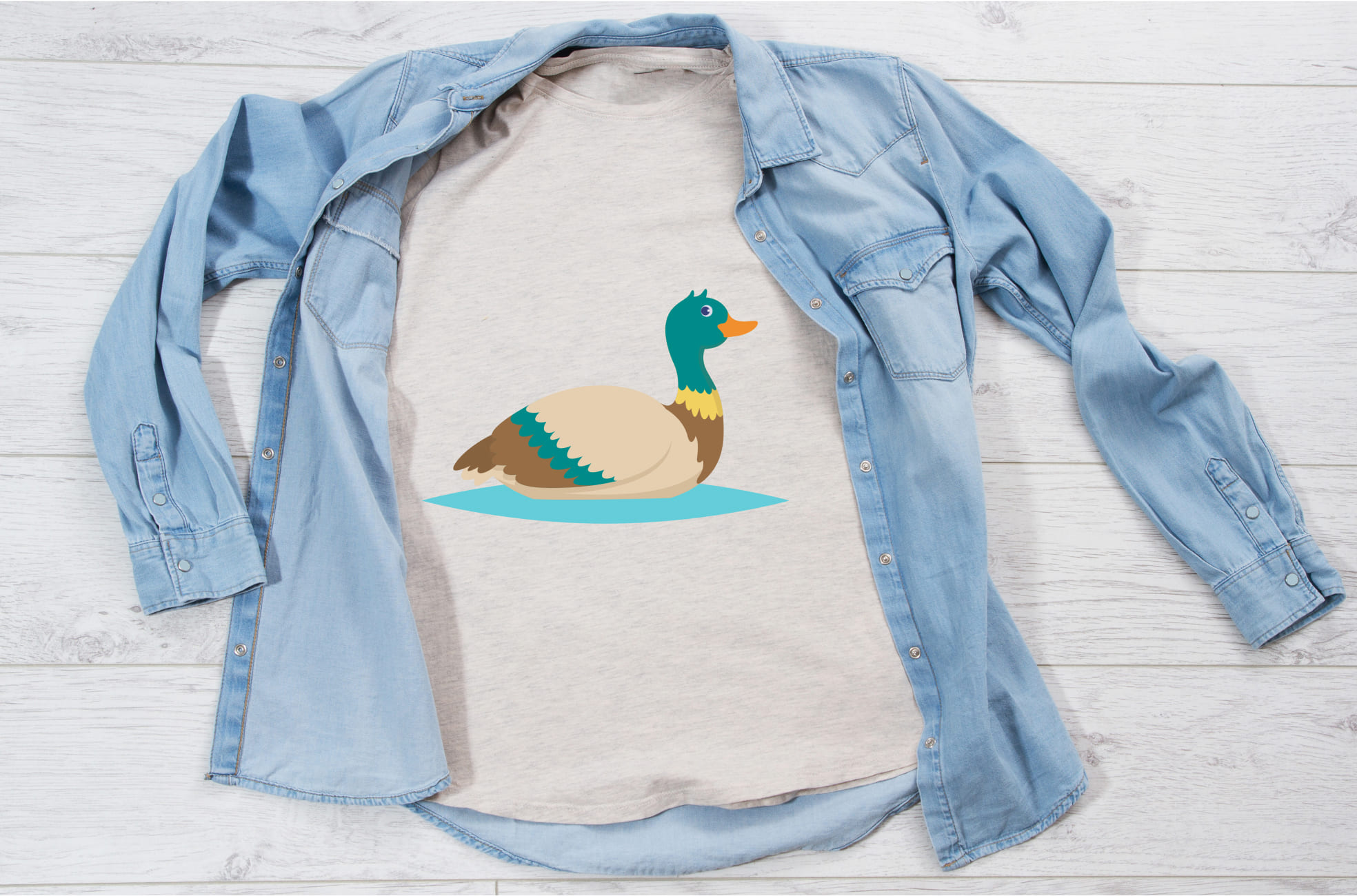Image of a white T-shirt with an enchanting print of a flying duck.