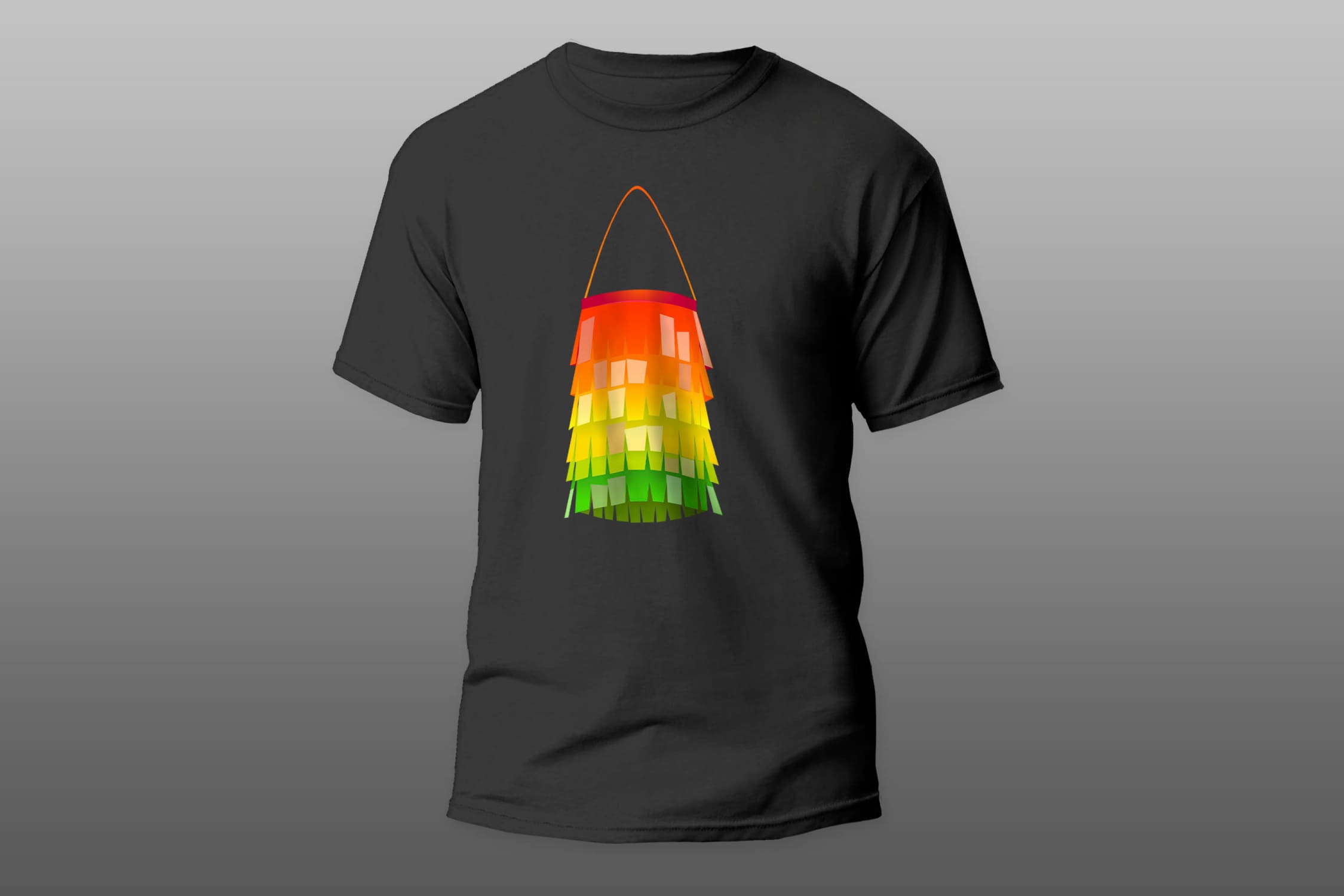 Black t-shirt with a colorful christmas decoration on a gray gradient background.