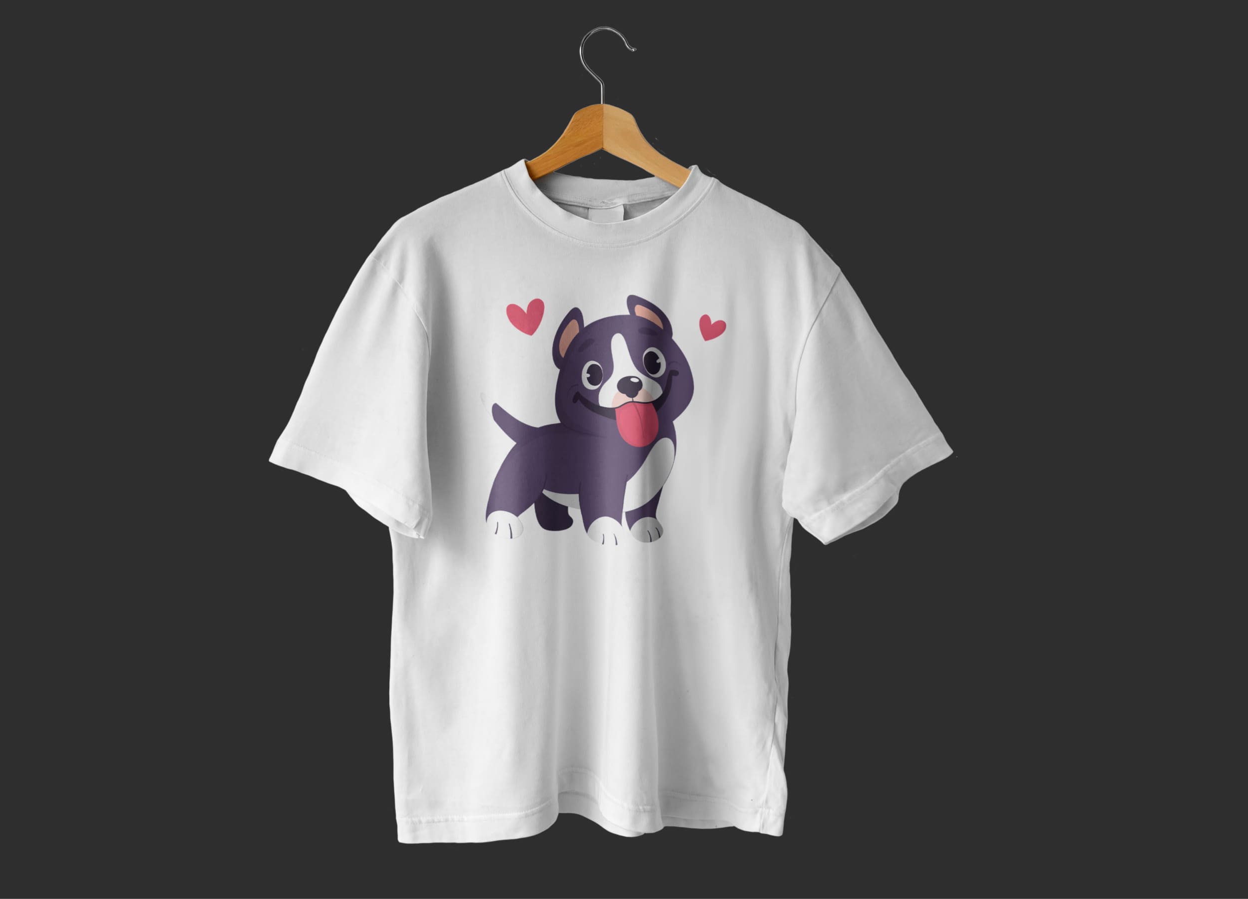 White t-shirt with a happy pitbull and two pink hearts on a dark gray background.