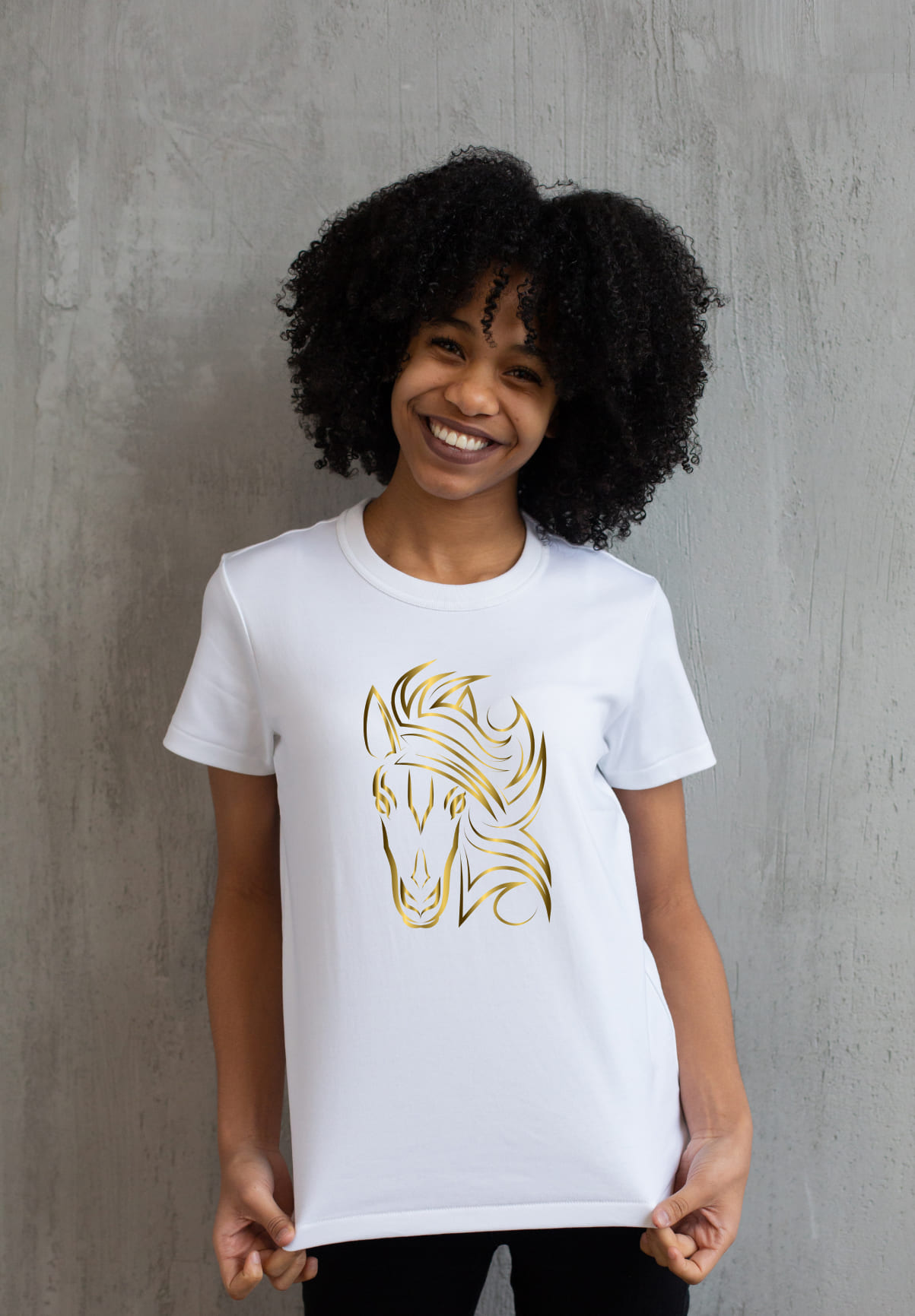 White t-shirt with a golden horse face on a girl.