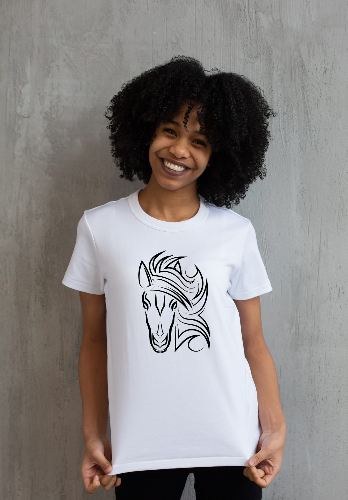 White t-shirt with a black horse face on a girl.
