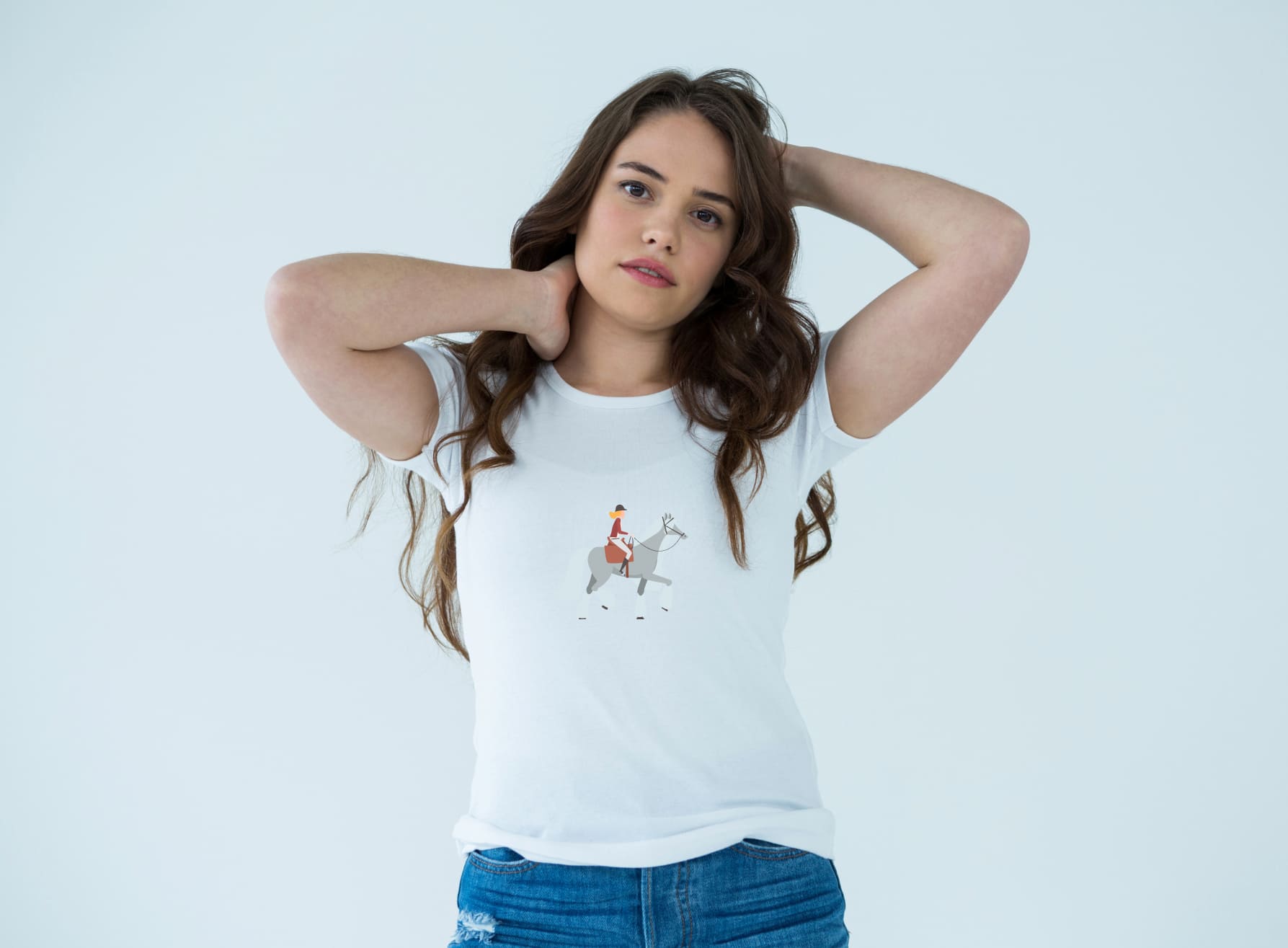White t-shirt with an image of a light gray horse riding, on a girl on a light blue background.