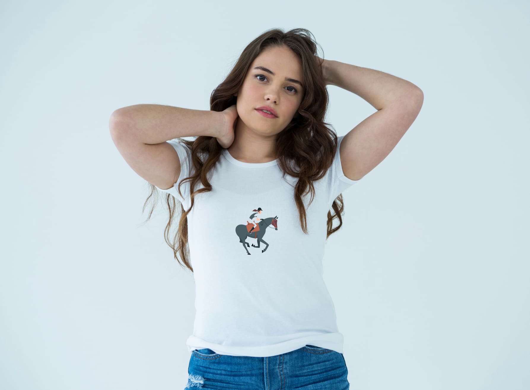 White t-shirt with an image of a gray horse riding, on a girl on a light blue background.