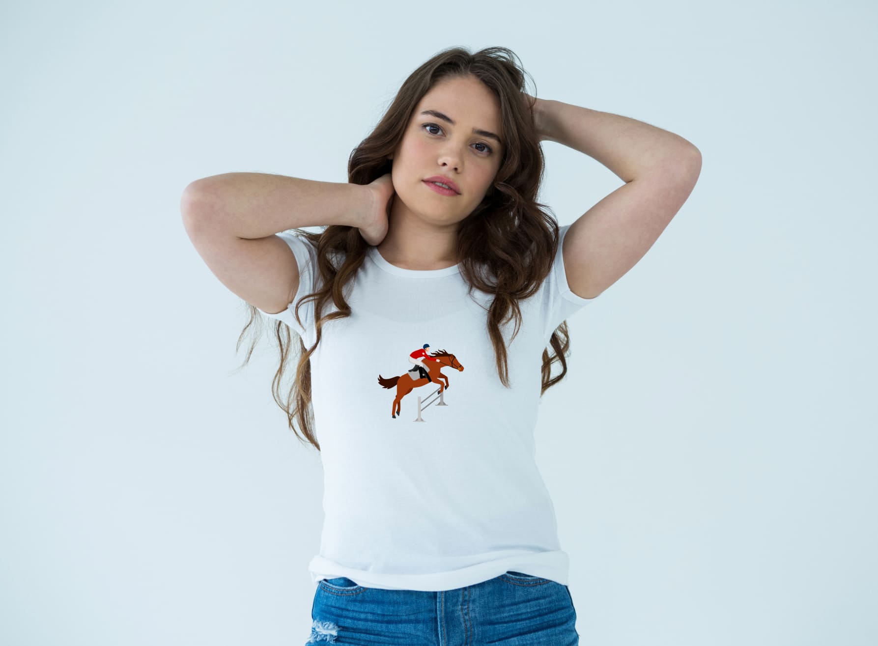 White t-shirt with an image of a brown horse riding, on a girl on a light blue background.
