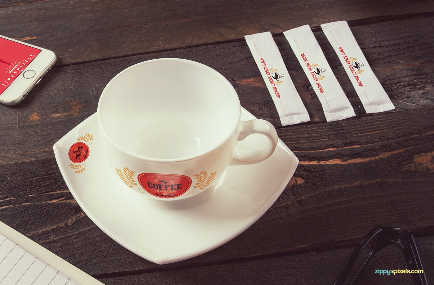 Simple white coffee cup with the small red logo.