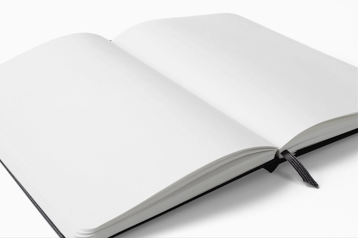 A black notebook in open view with white sheets on a white background.