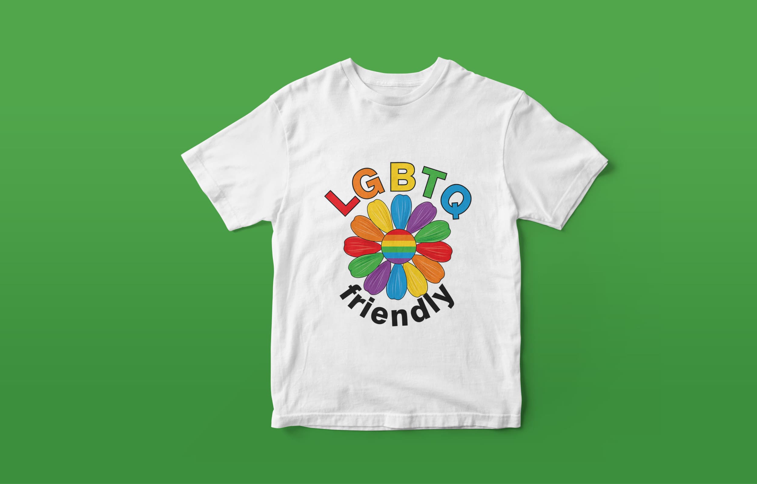 White t-shirt with "LGBTQ" lettering in LGBT colors and black "friendly" lettering and a flower in LGBT colors on a green background.