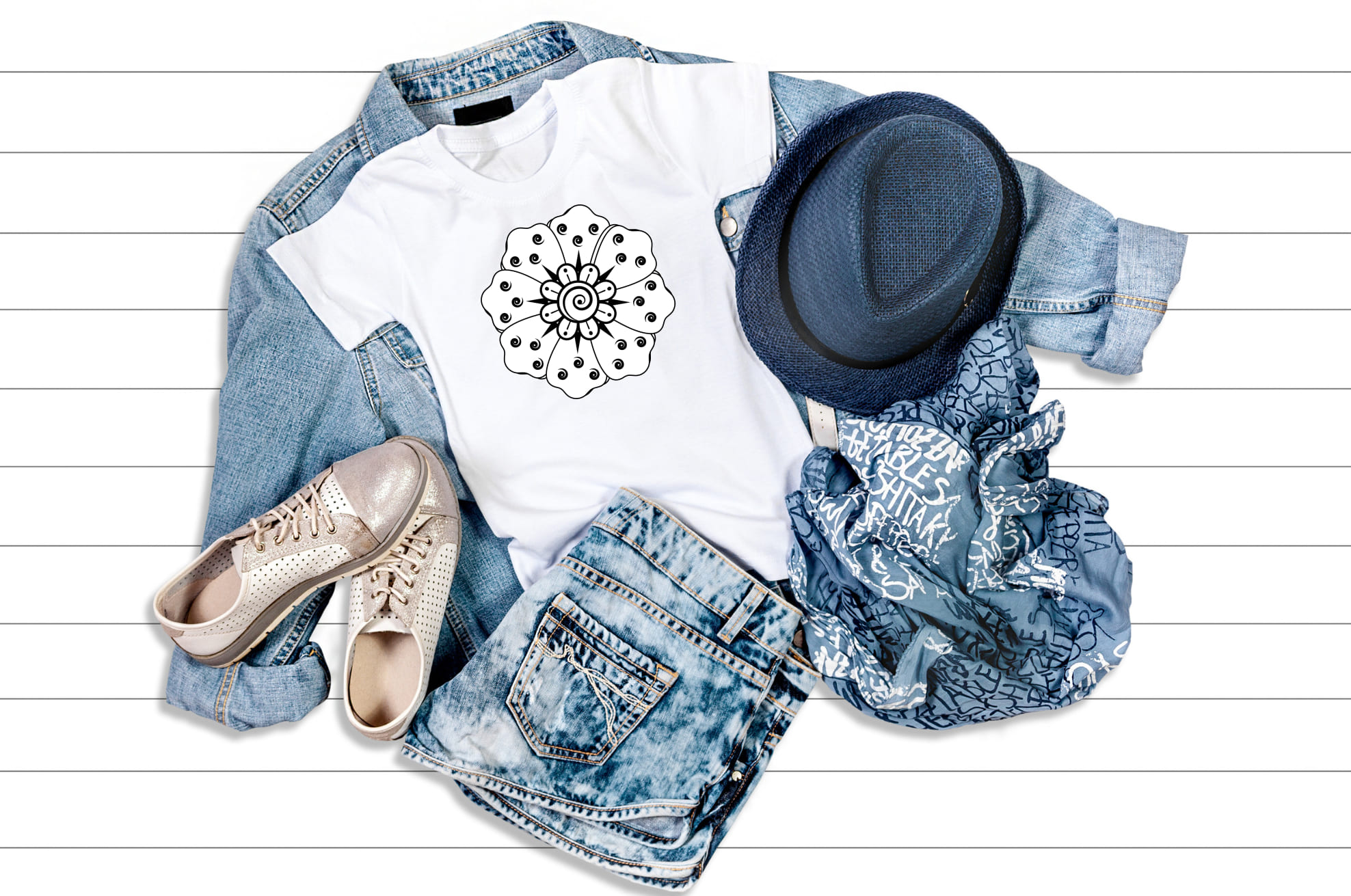 Jeans look with the white t-shirt with a laconic and delicate mandala illustration.