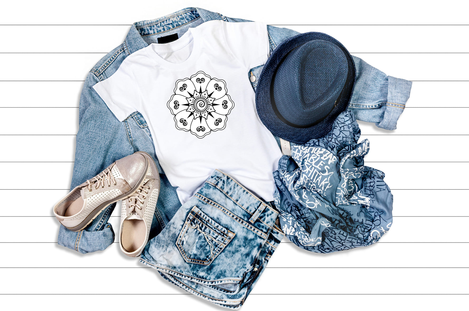 Jeans look with the white t-shirt with a mandala illustration.