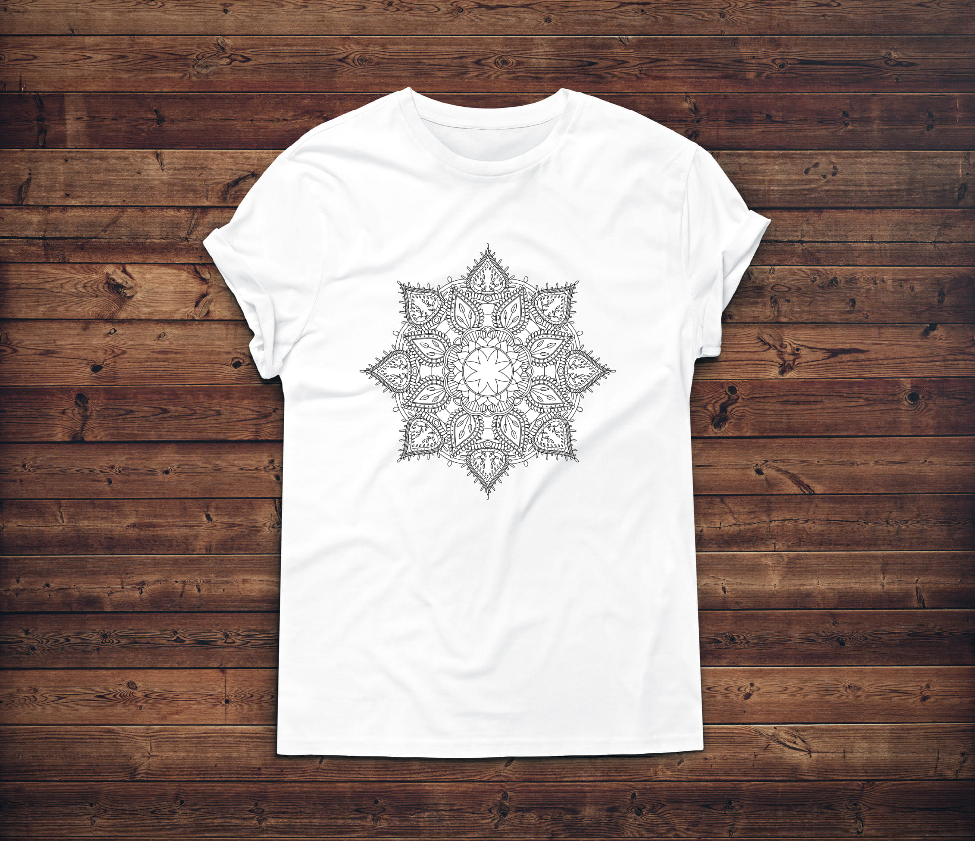 Beautiful mandala in a geometric shape on the white t-shirt.