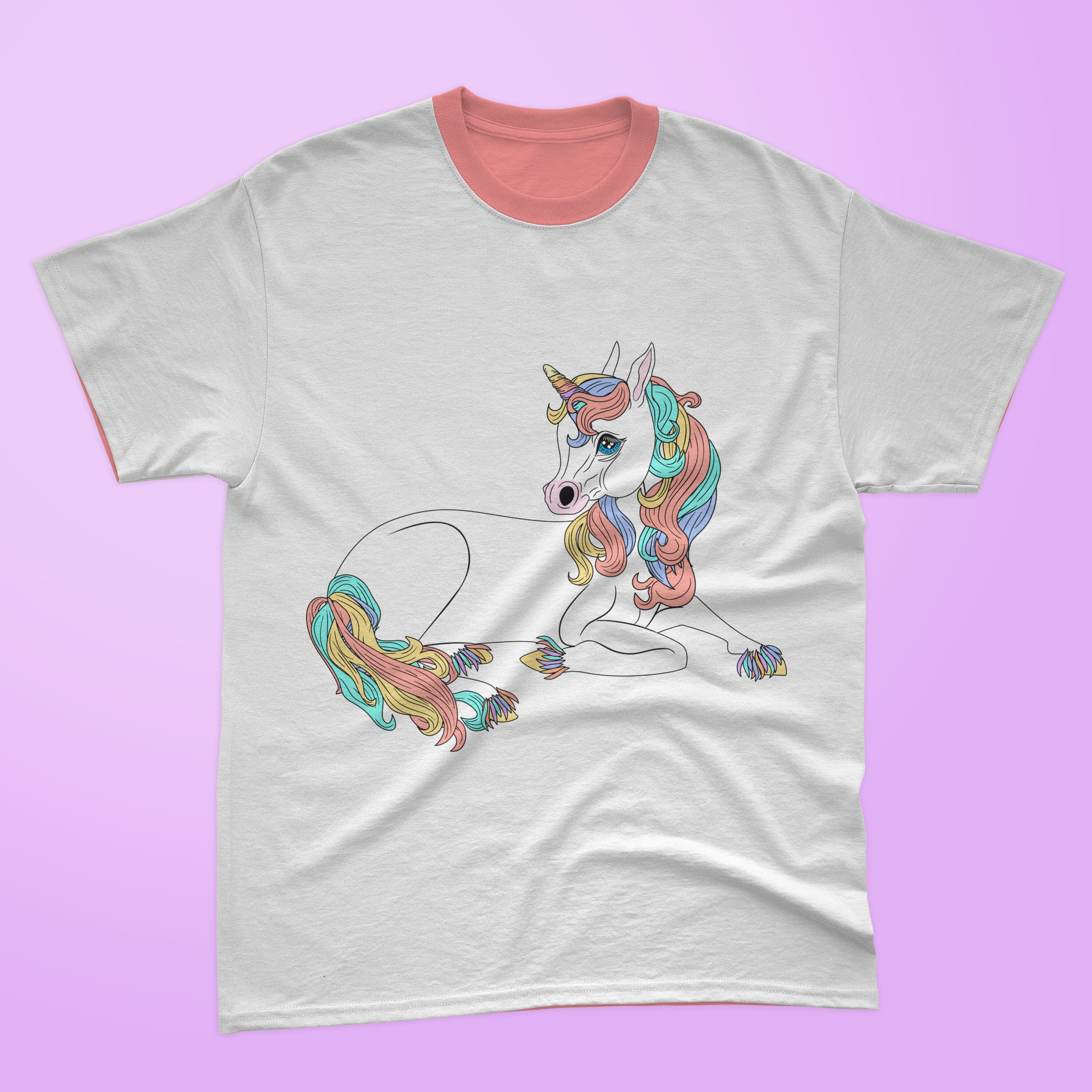 Gray t-shirt with a pink collar and a magical lying unicorn on a lavender background.