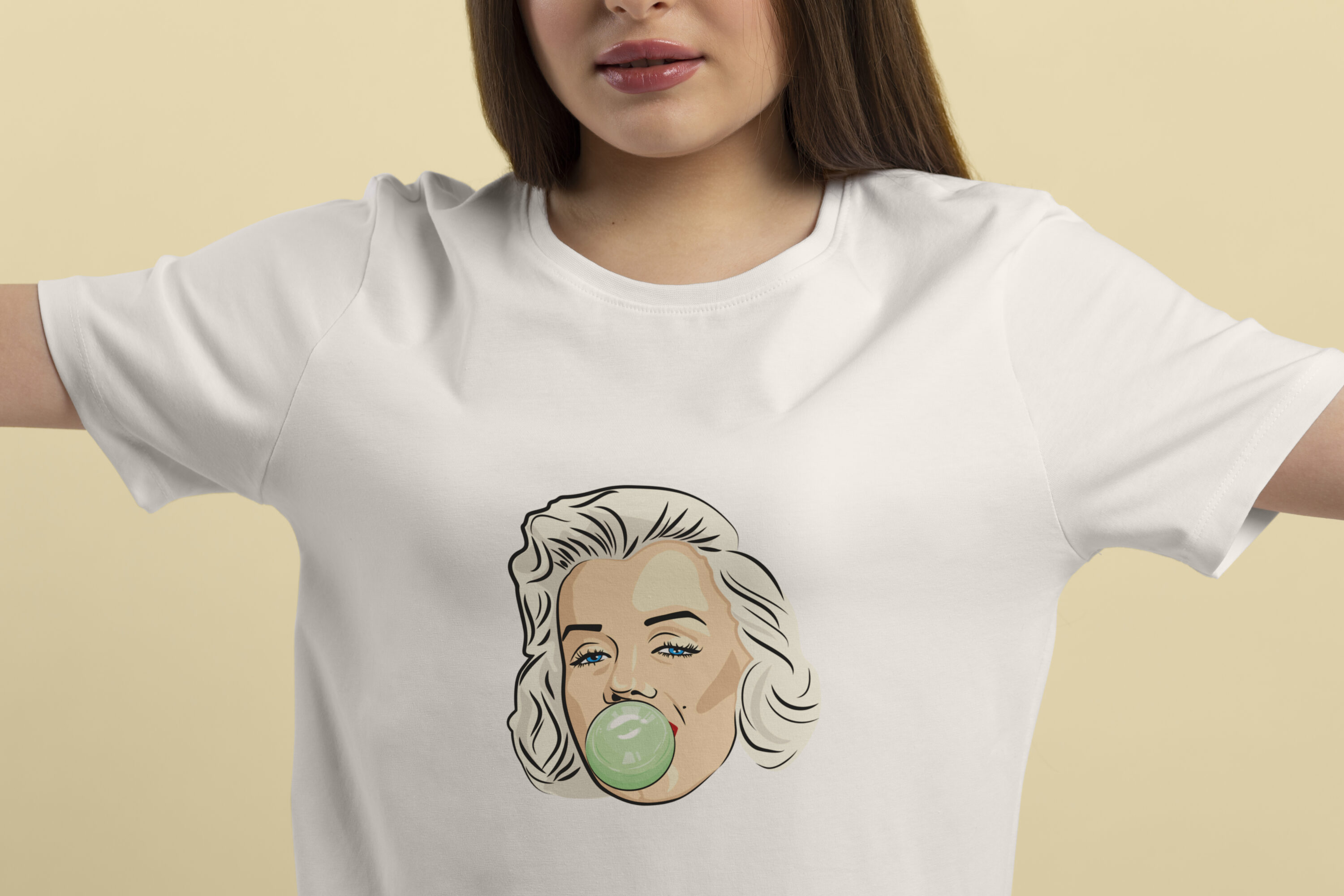 Image of white t-shirts with marvelous print of Marilyn Monroe with bubble gum.