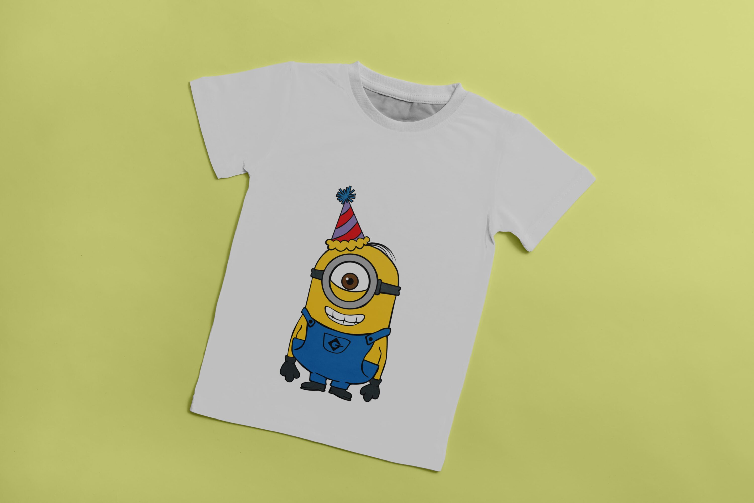 White T-shirt with an image of a surprised Minion with a party hat.