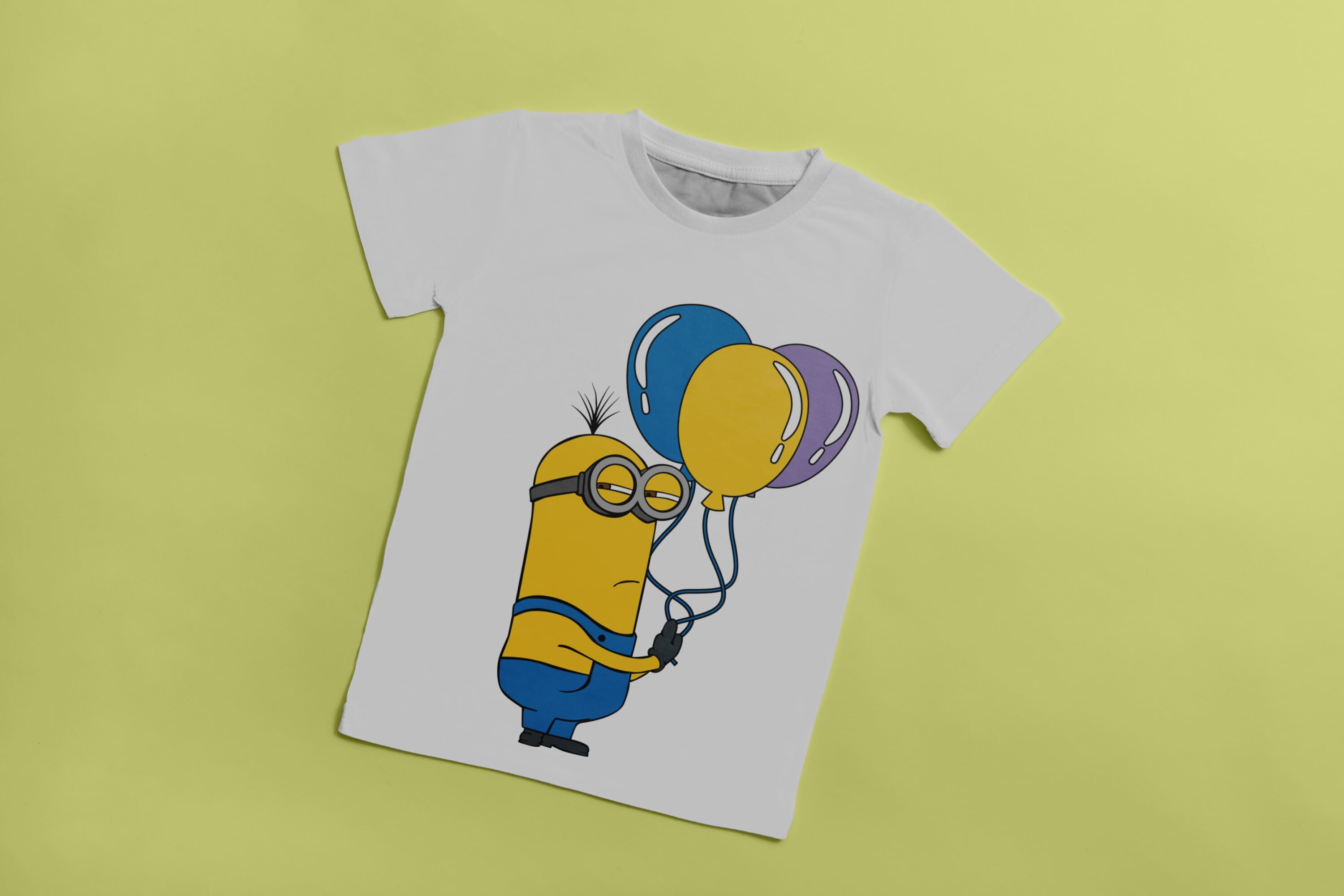 White T-shirt with the image of the offended Minion with blue, yellow and grey balloon.