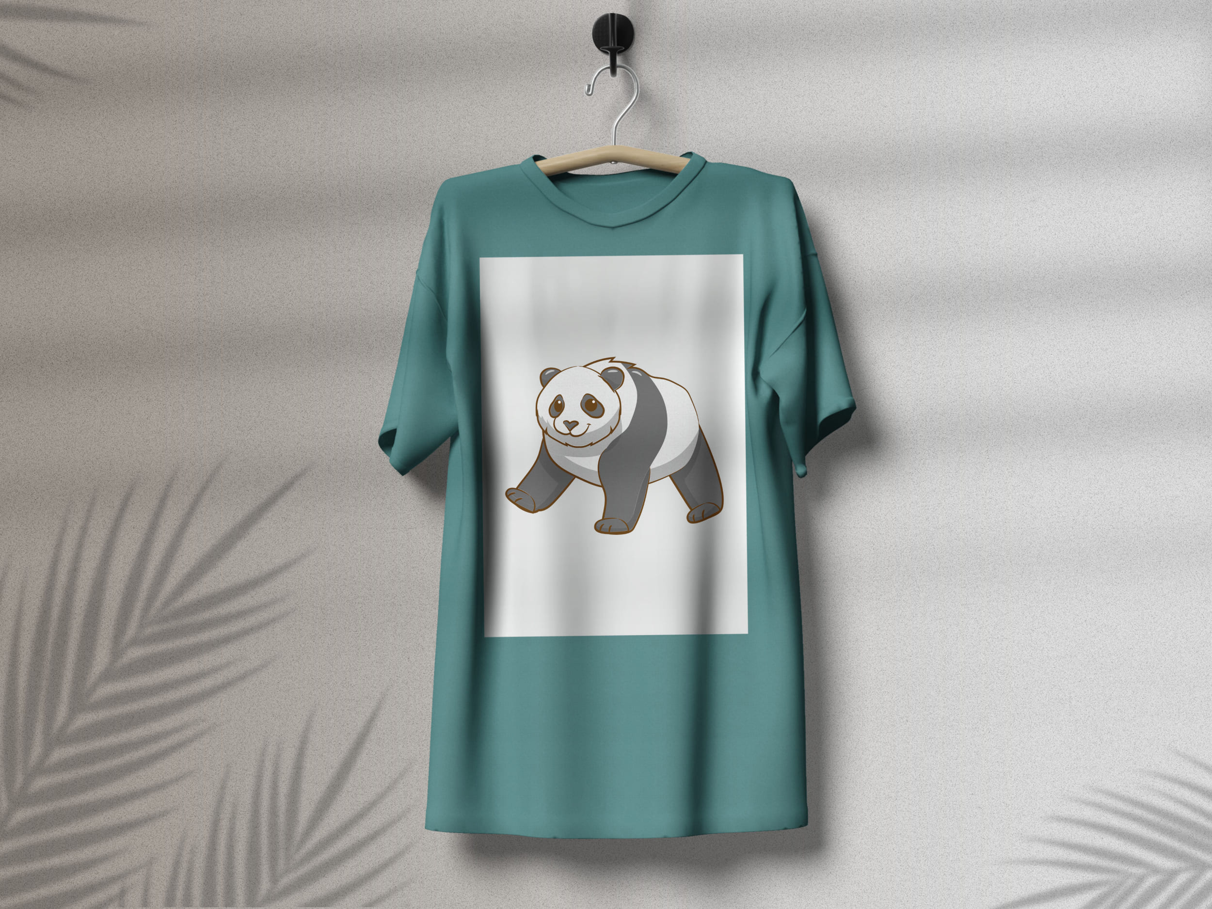 Turquoise t-shirt with a cute panda on a white background, on a hanger on a gray background