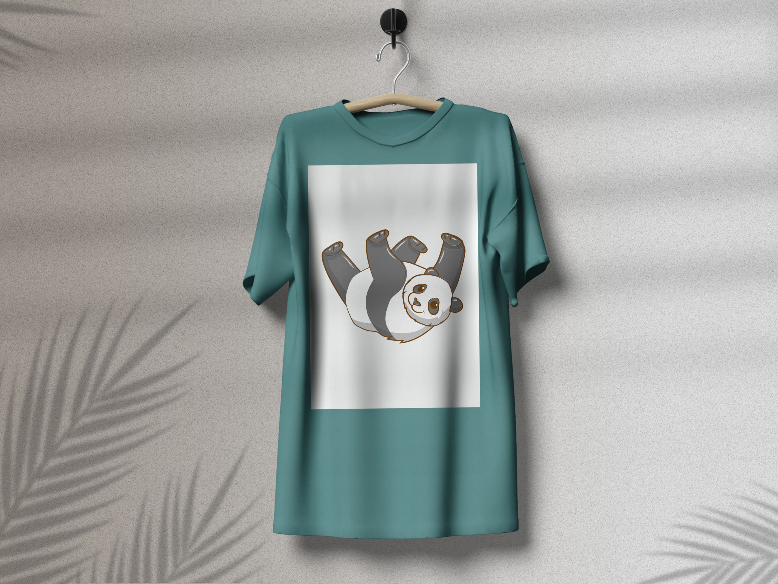 Turquoise t-shirt with a happy panda on a white background, on a hanger on a gray background
