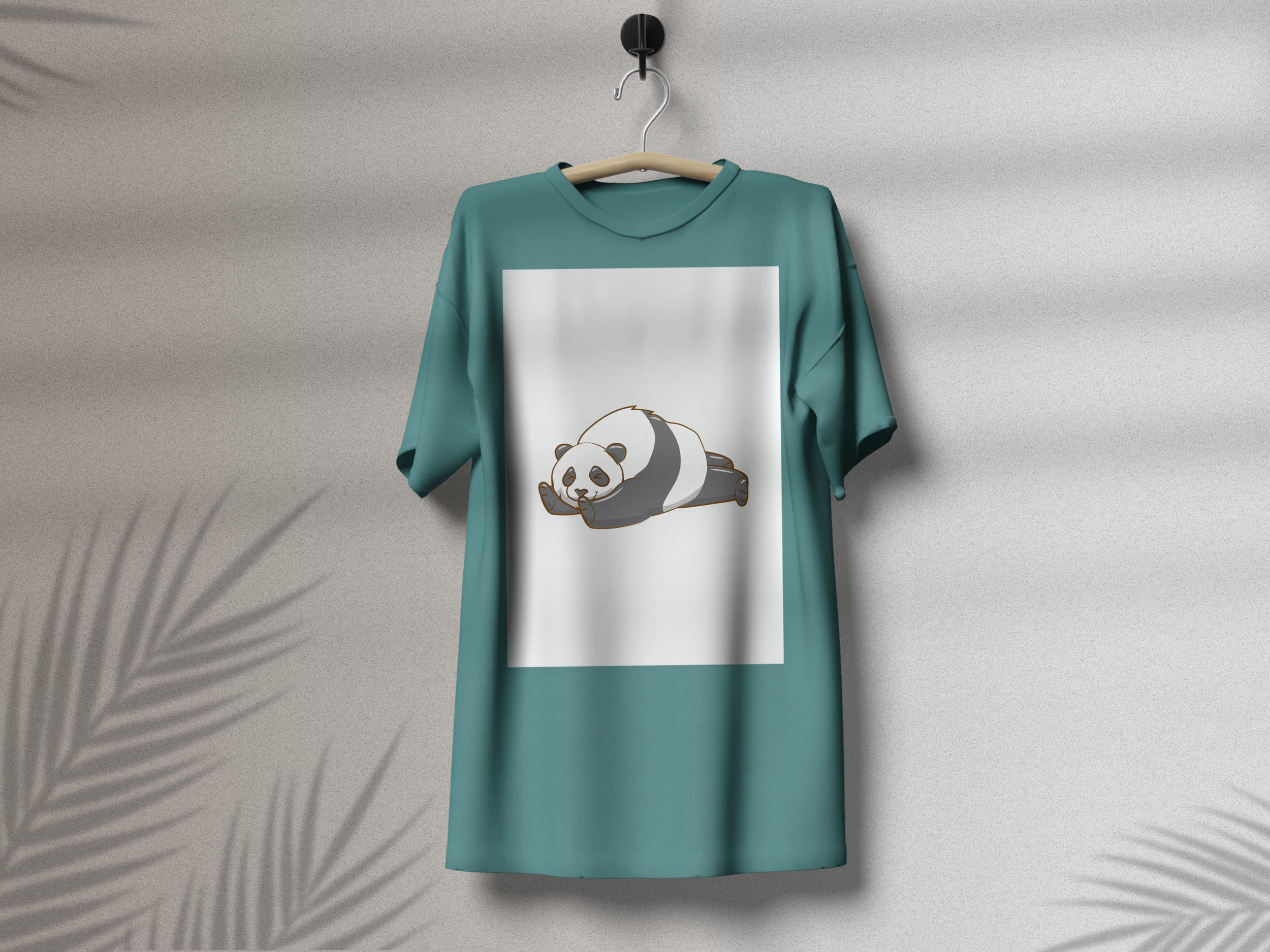 Turquoise t-shirt with a sleeping panda on a white background, on a hanger on a gray background