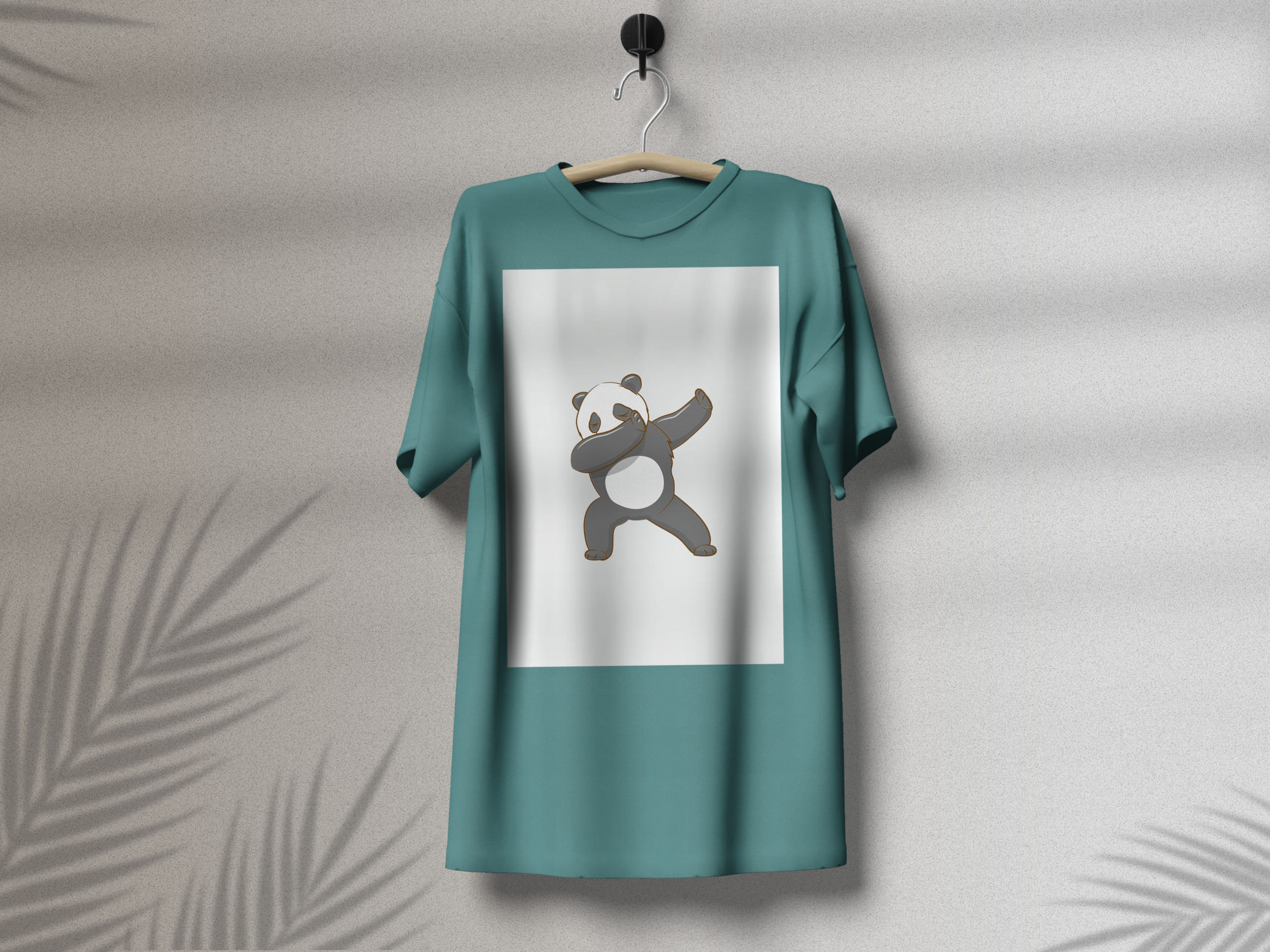 Turquoise t-shirt with a dancing panda on a white background, on a hanger on a gray background