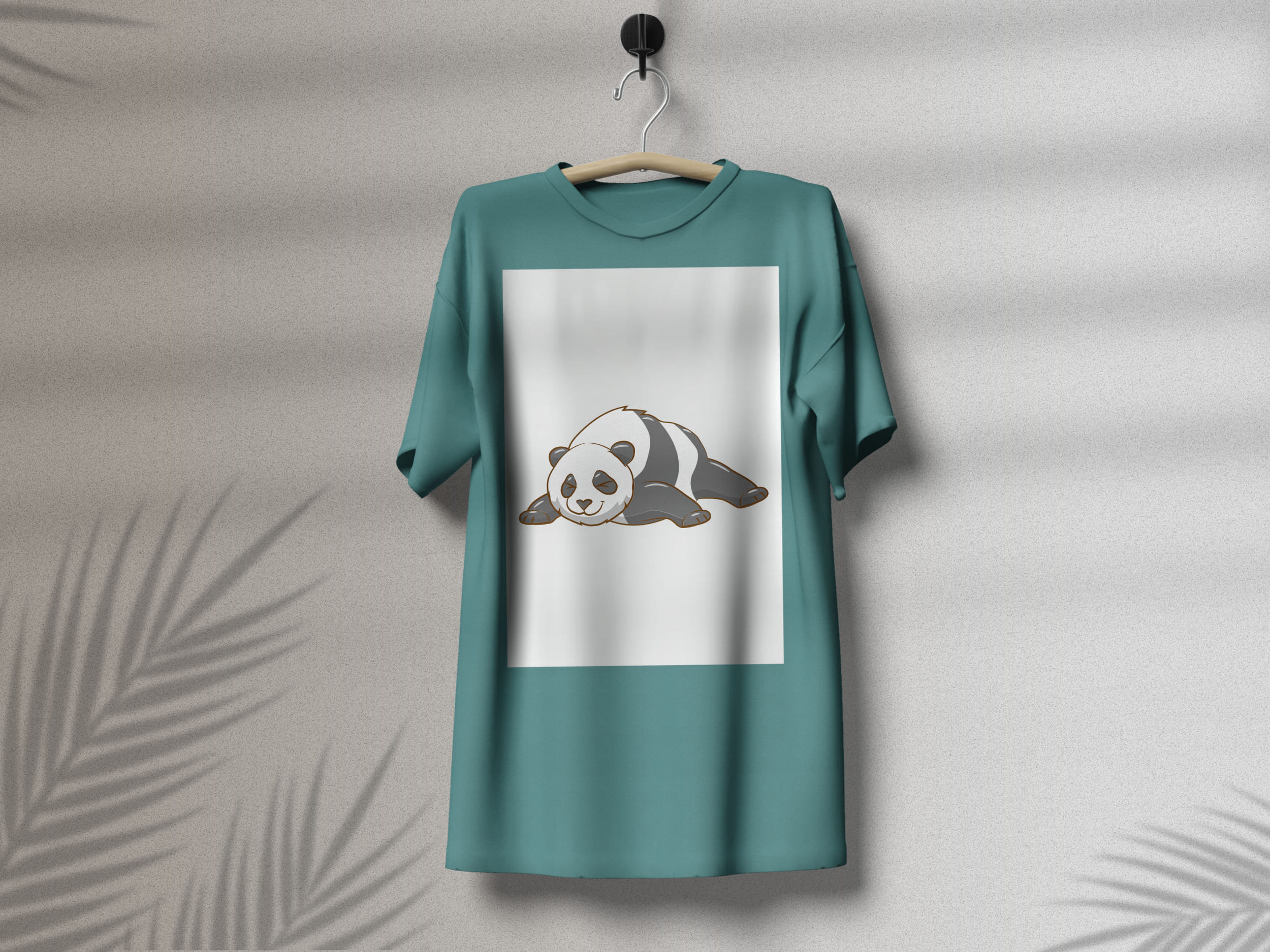 Turquoise t-shirt with a lying panda on a white background, on a hanger on a gray background